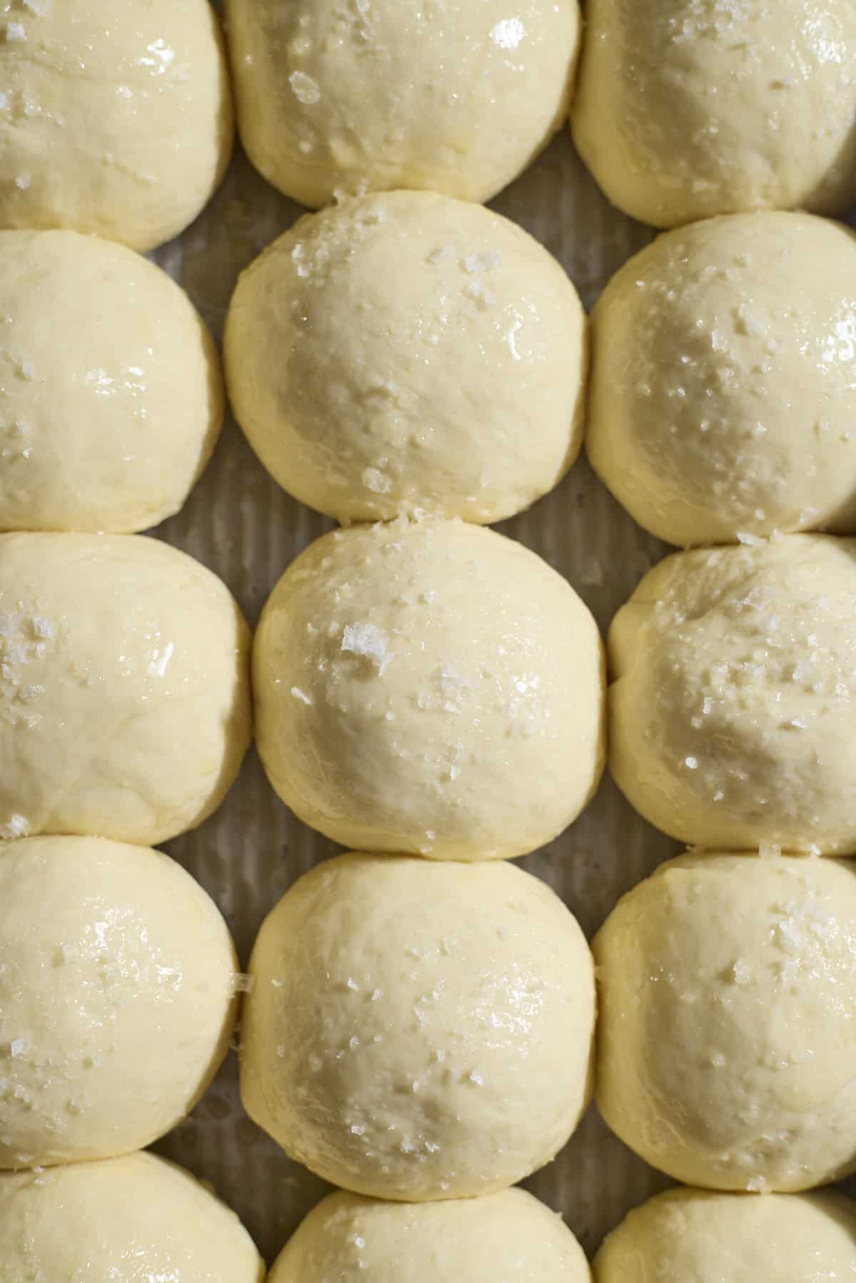 Dough brushed with melted butter and topped with flaky sea salt.