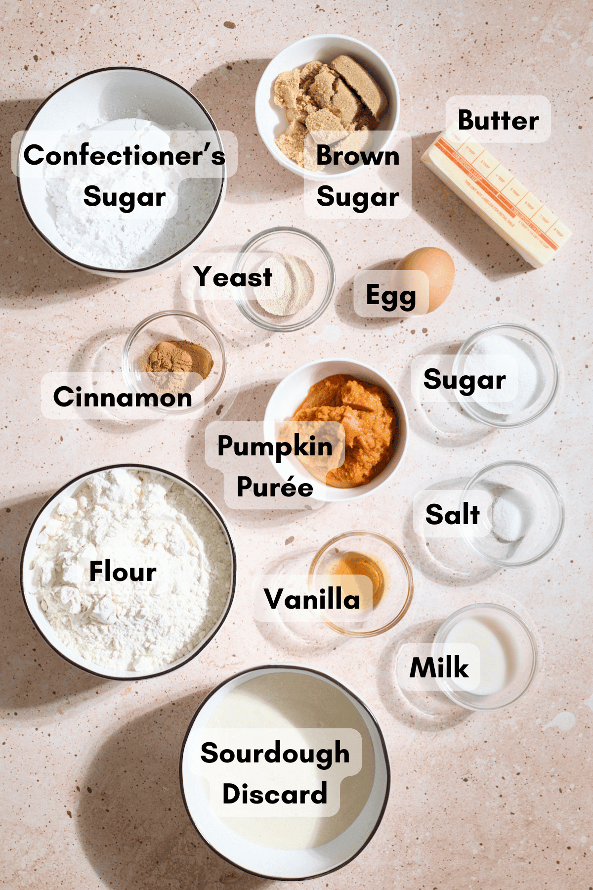 Ingredients for Sourdough Discard Pumpkin Pull Apart Bread in small bowls.