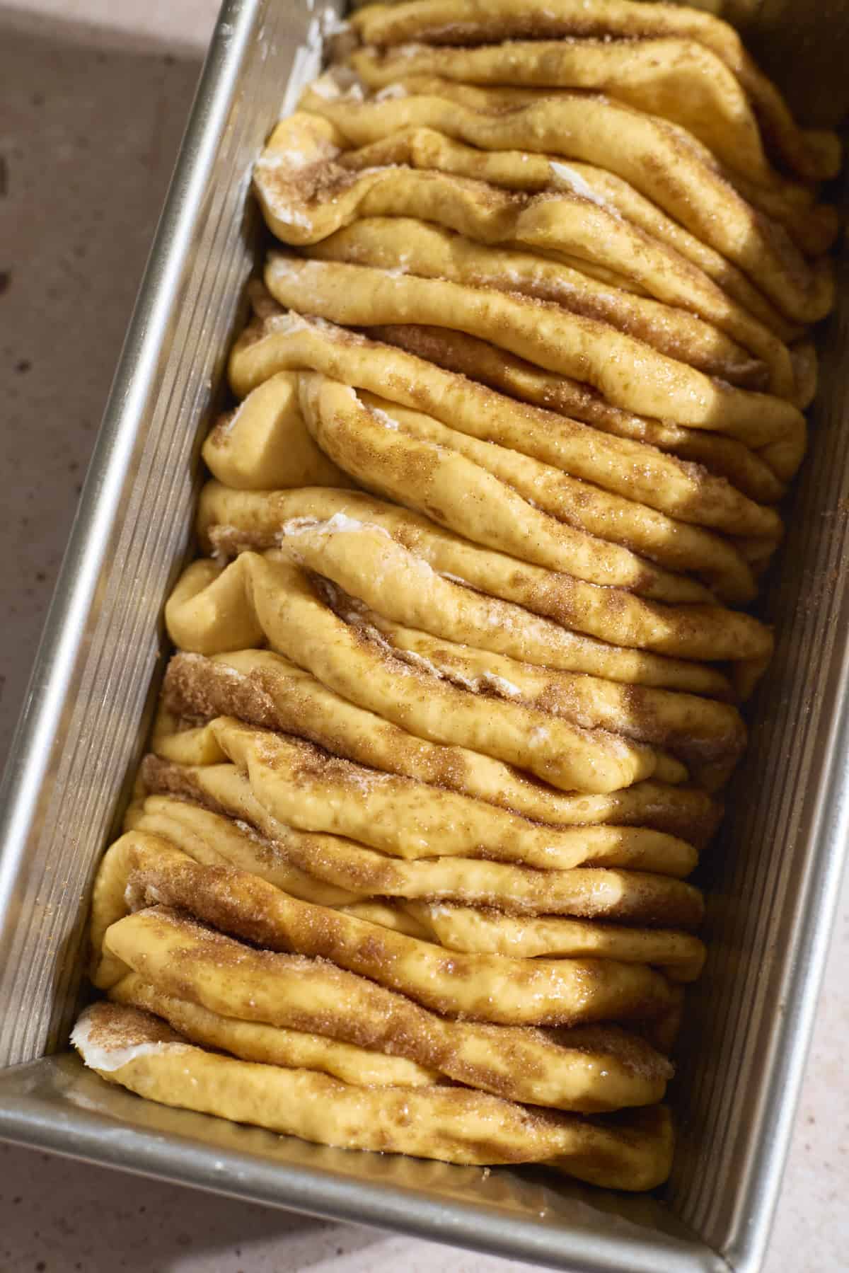 Layers of dough in the baking pan.