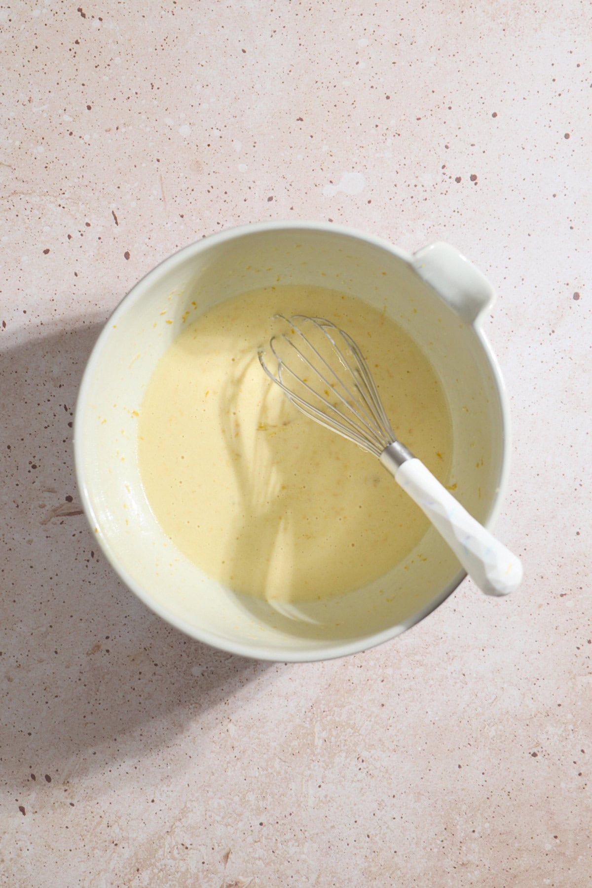 Wet ingredients mixed together in a mixing bowl.