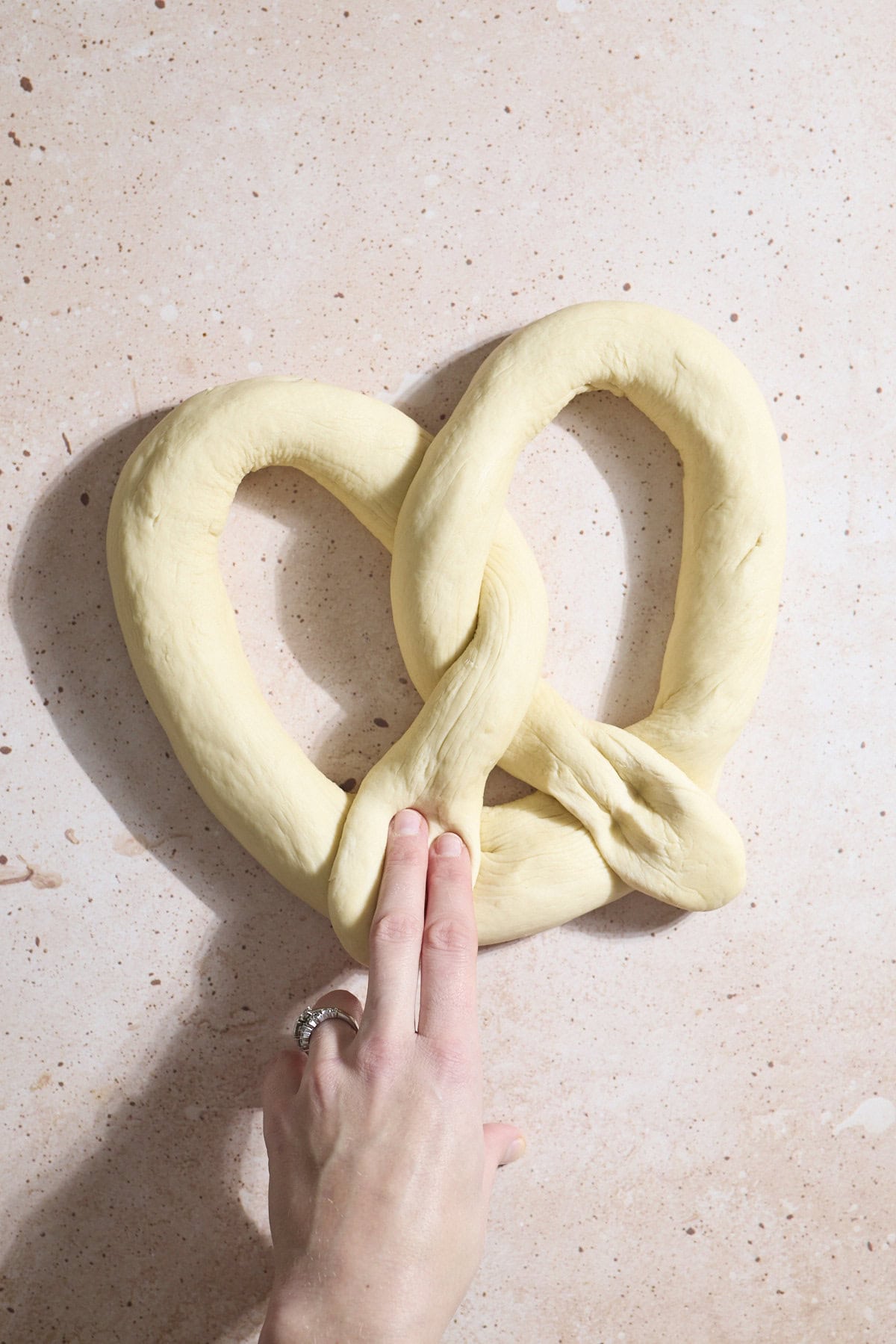 Dough shaped into a pretzel.