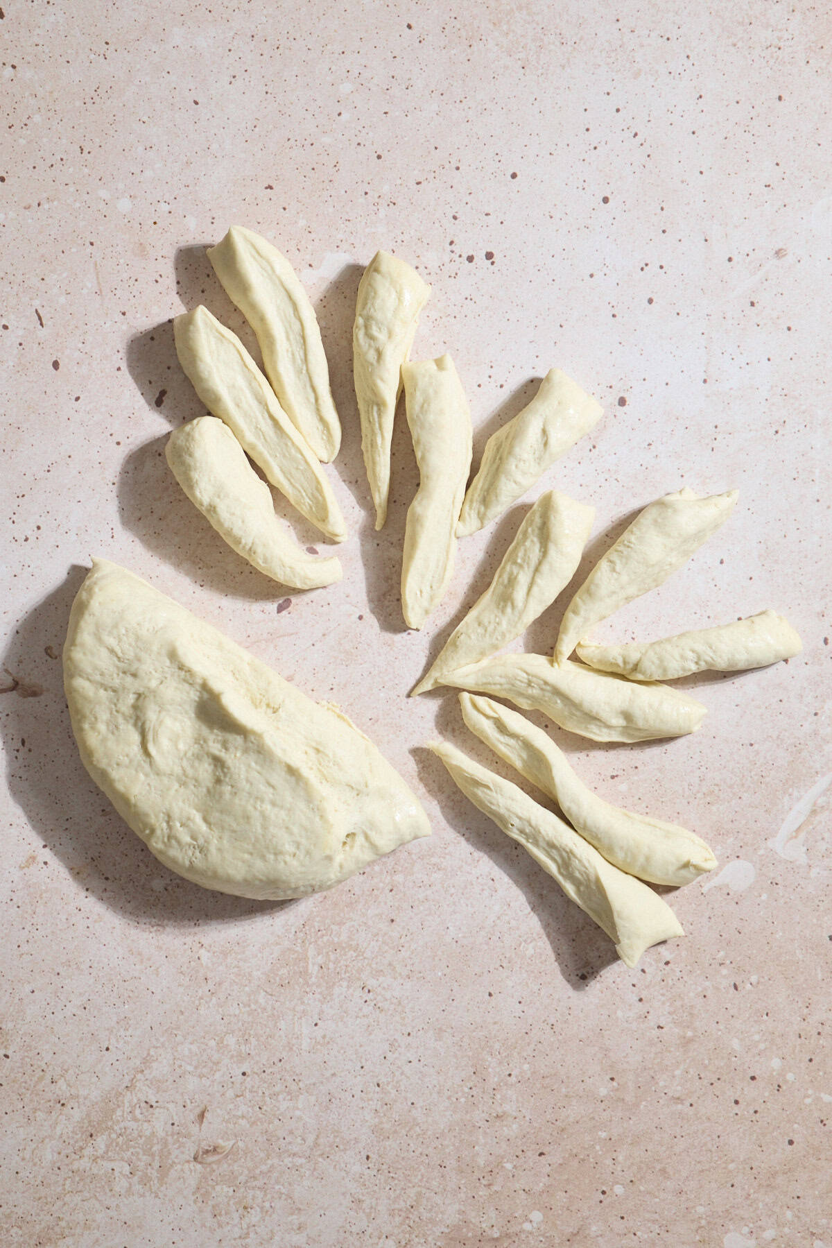 Dough being divided into 24 pieces.