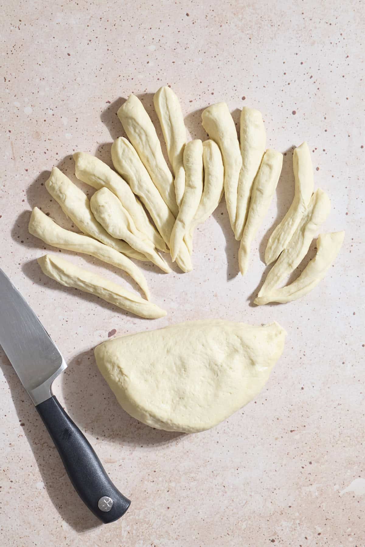 Dough being divided into portions.