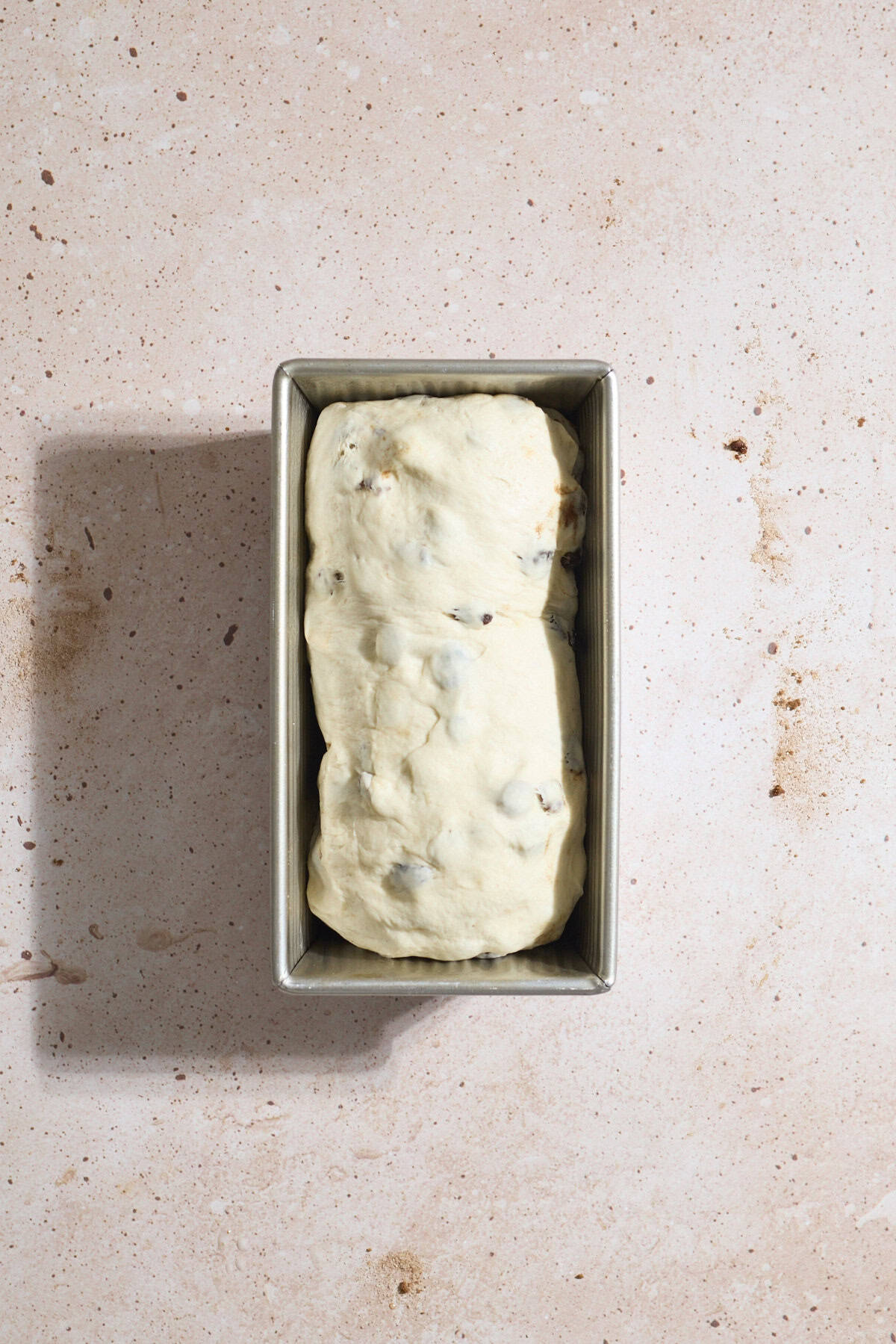 Sourdough Discard Cinnamon Raisin Bread in the baking pan.