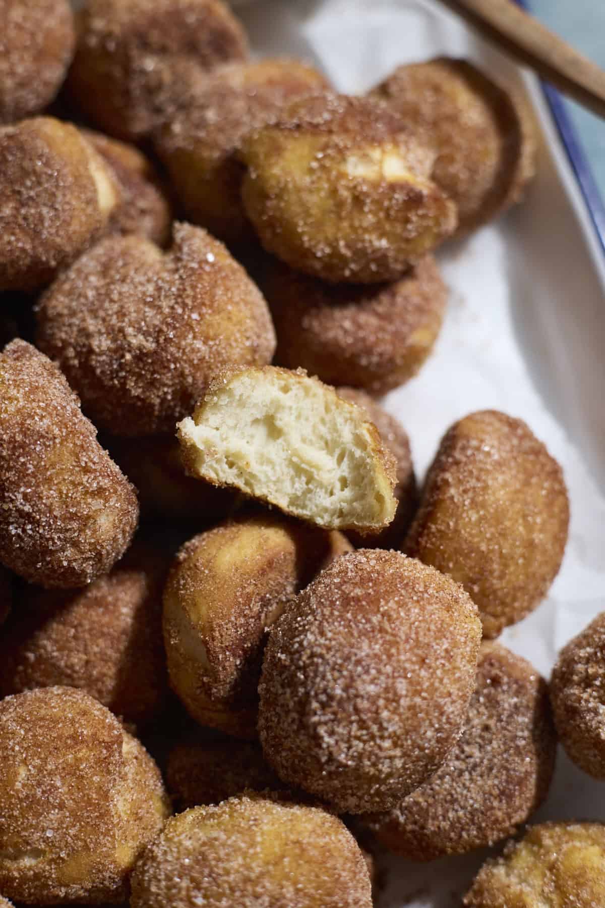 A pretzel bite bitten in half.