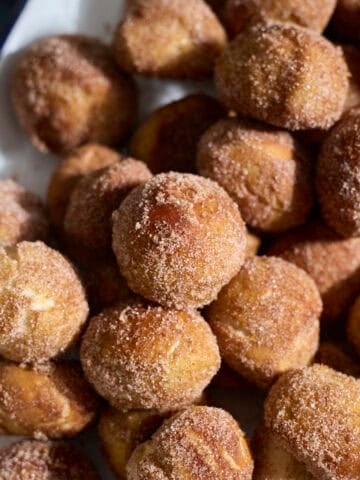 Sourdough Discard Cinnamon Sugar Pretzel Bites on a white platter.