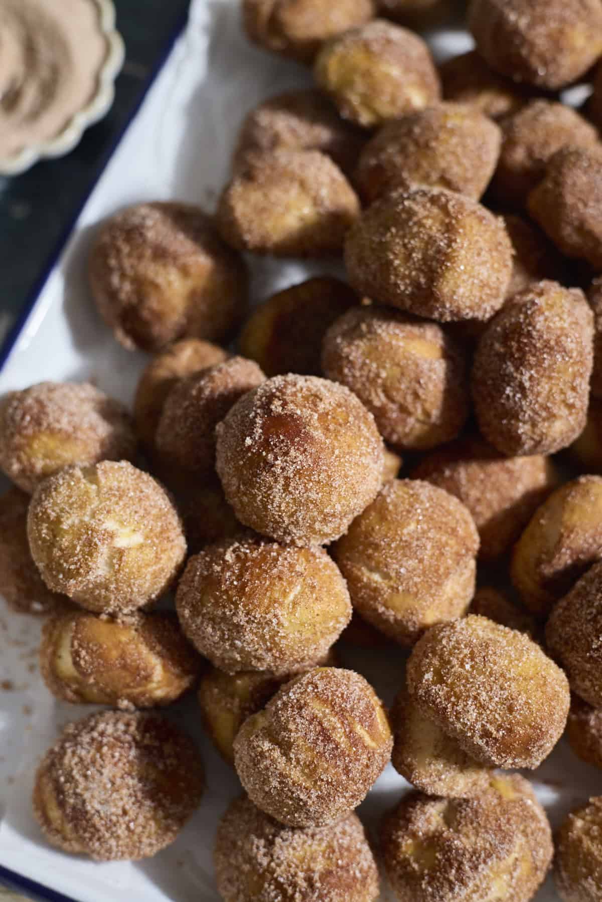 Sourdough Discard Cinnamon Sugar Pretzel Bites on a white platter.