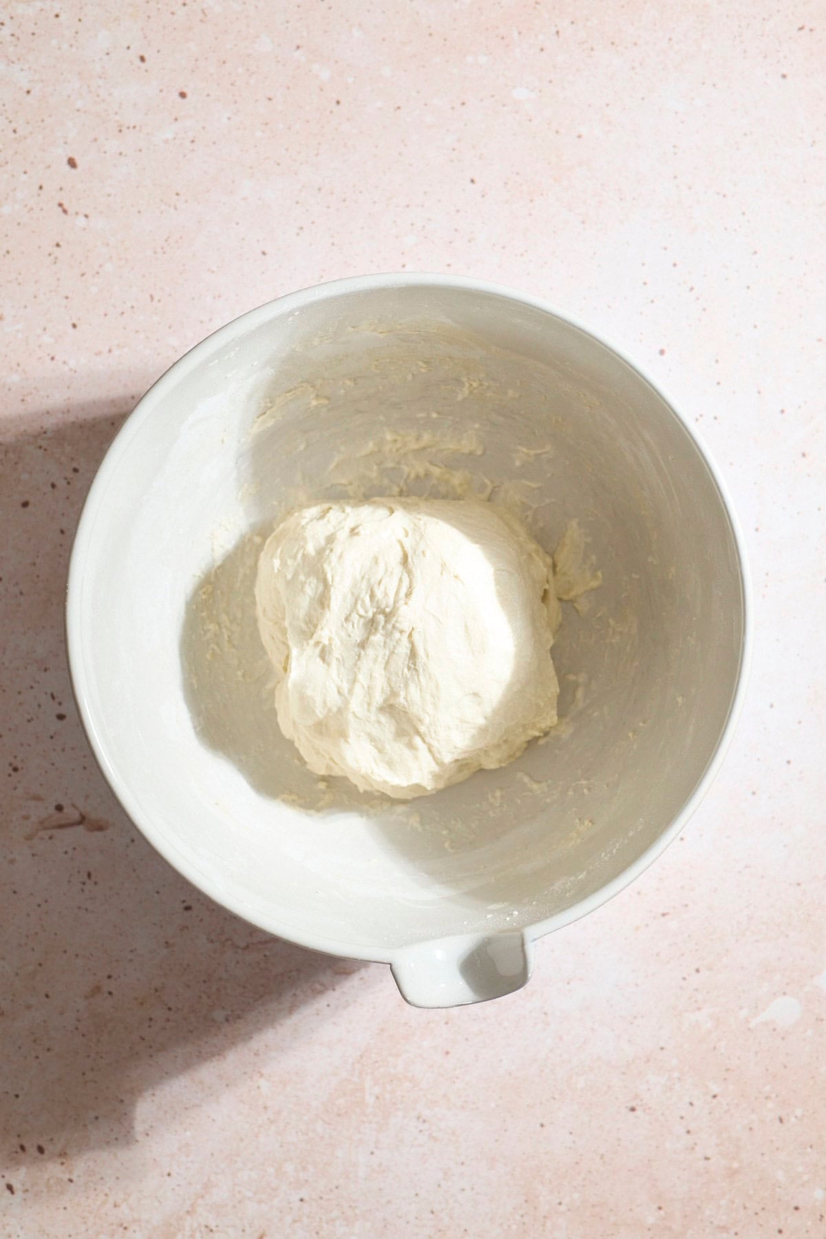 Dough in a large bowl after the first set of stretch and folds.