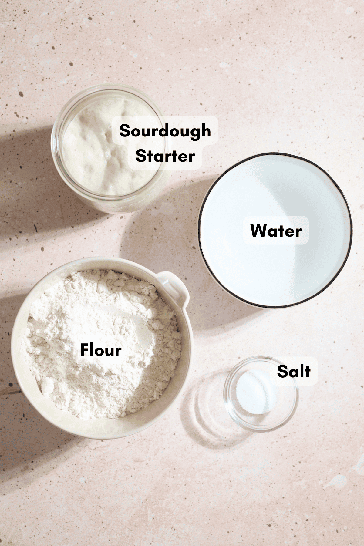Ingredients for Easy Sourdough Bread in small bowls.