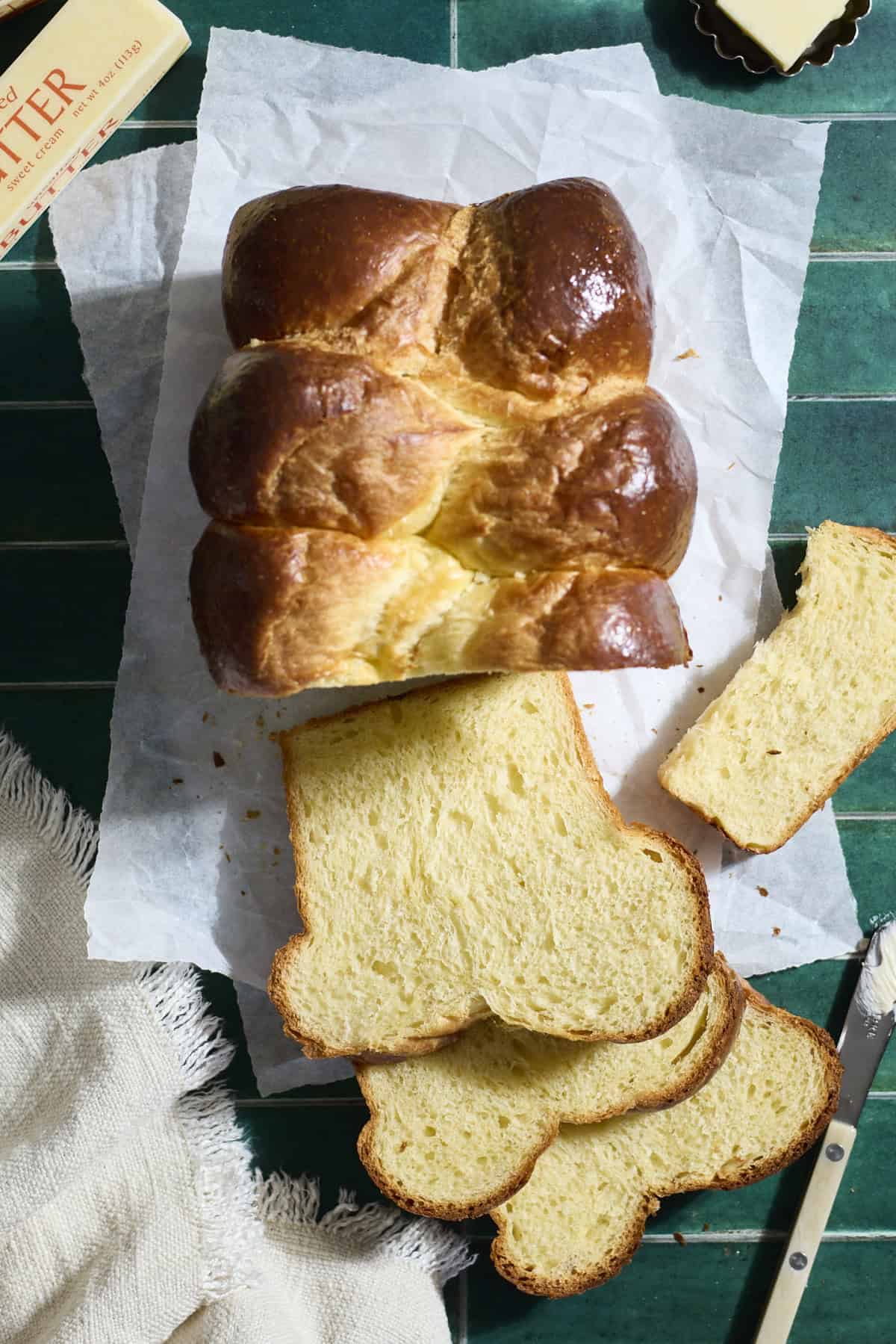 A sliced loaf of Sourdough Discard Brioche Bread.