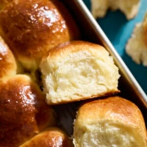 Sourdough Discard Brioche Rolls in a baking pan.