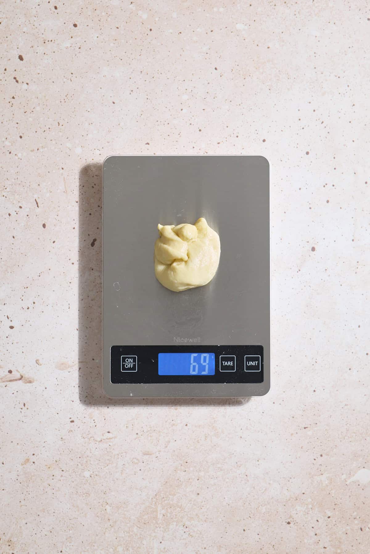 Dough divided on a kitchen scale.