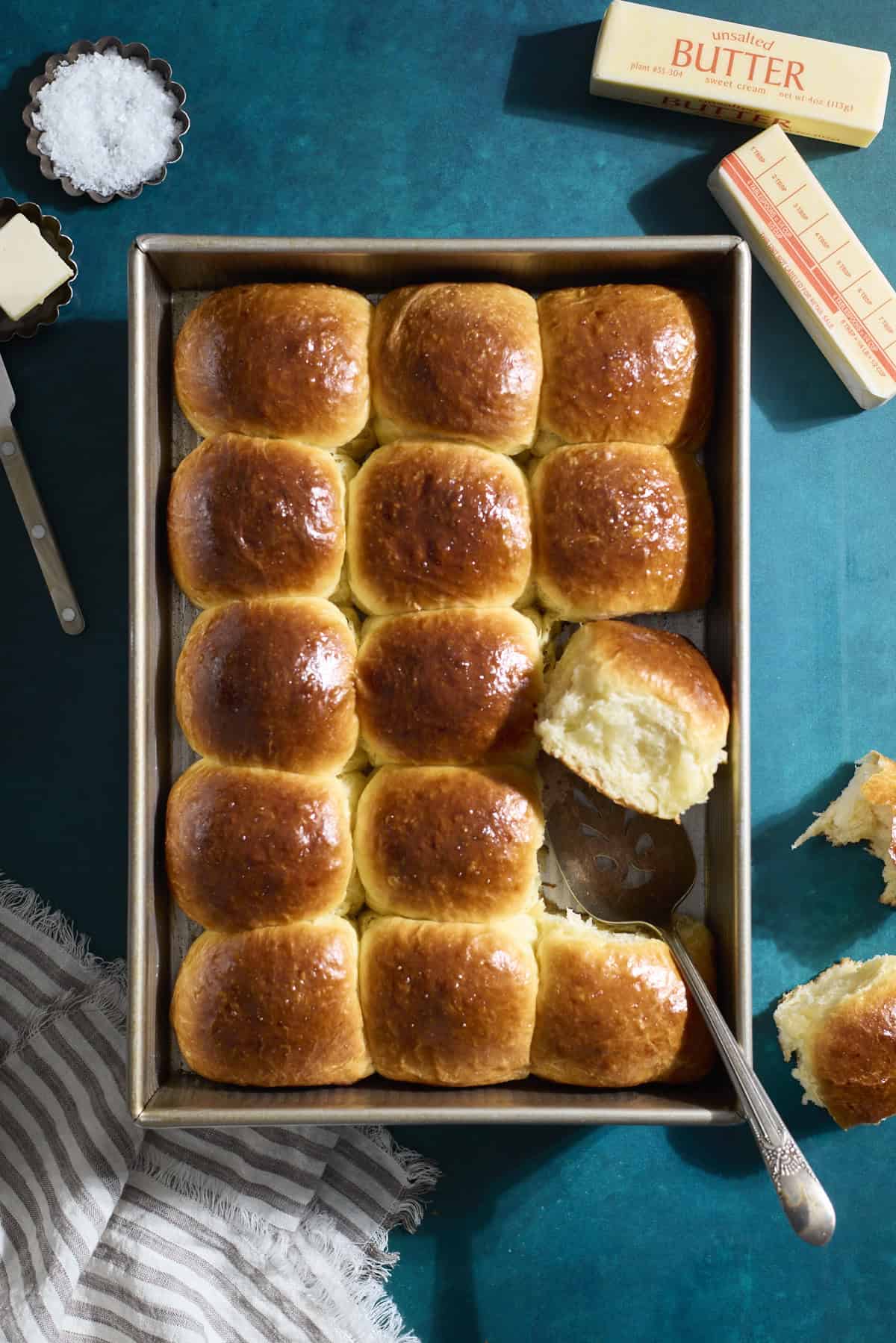 Sourdough Discard Brioche Rolls in a baking pan.