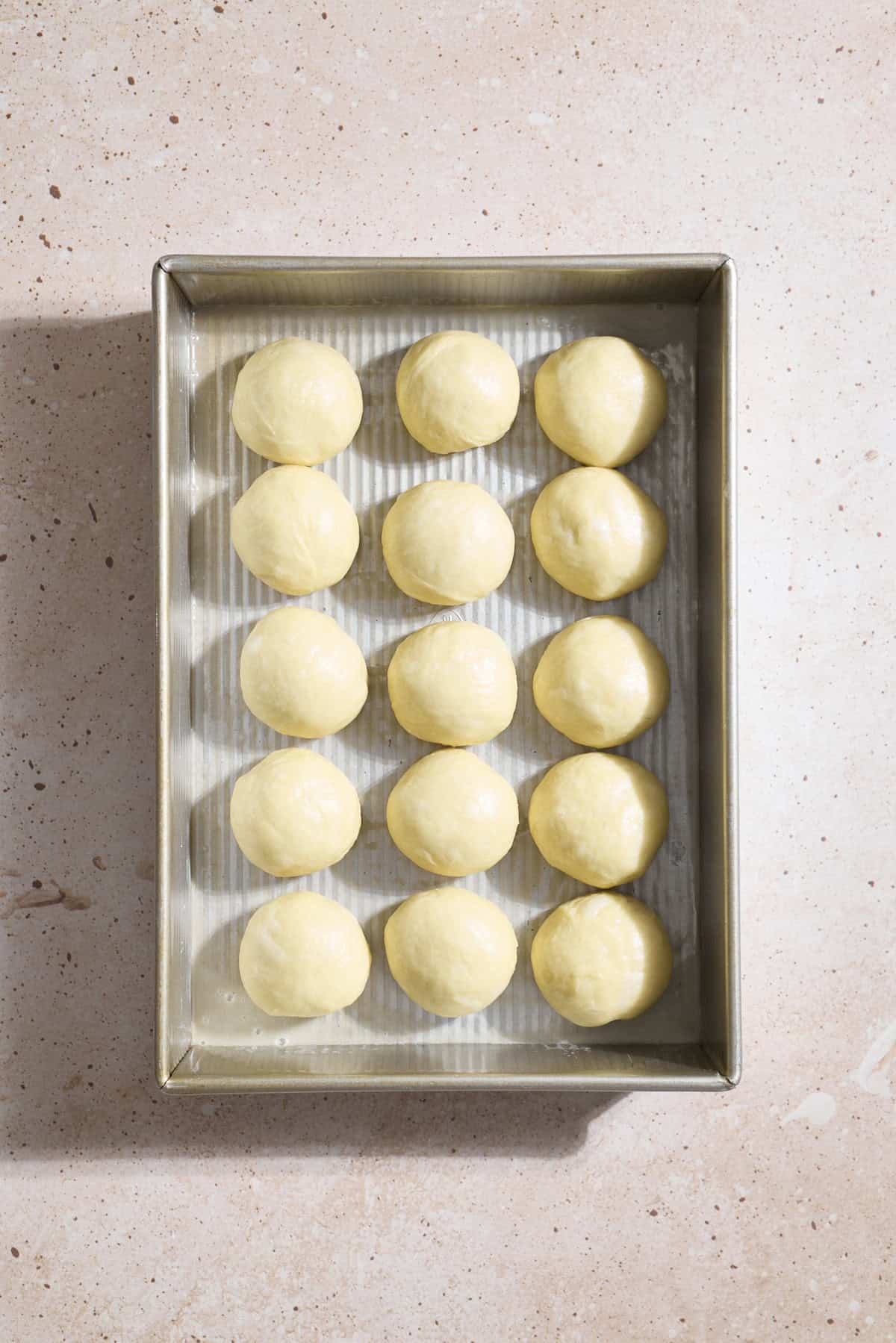 Rolls shaped and placed in the baking pan.