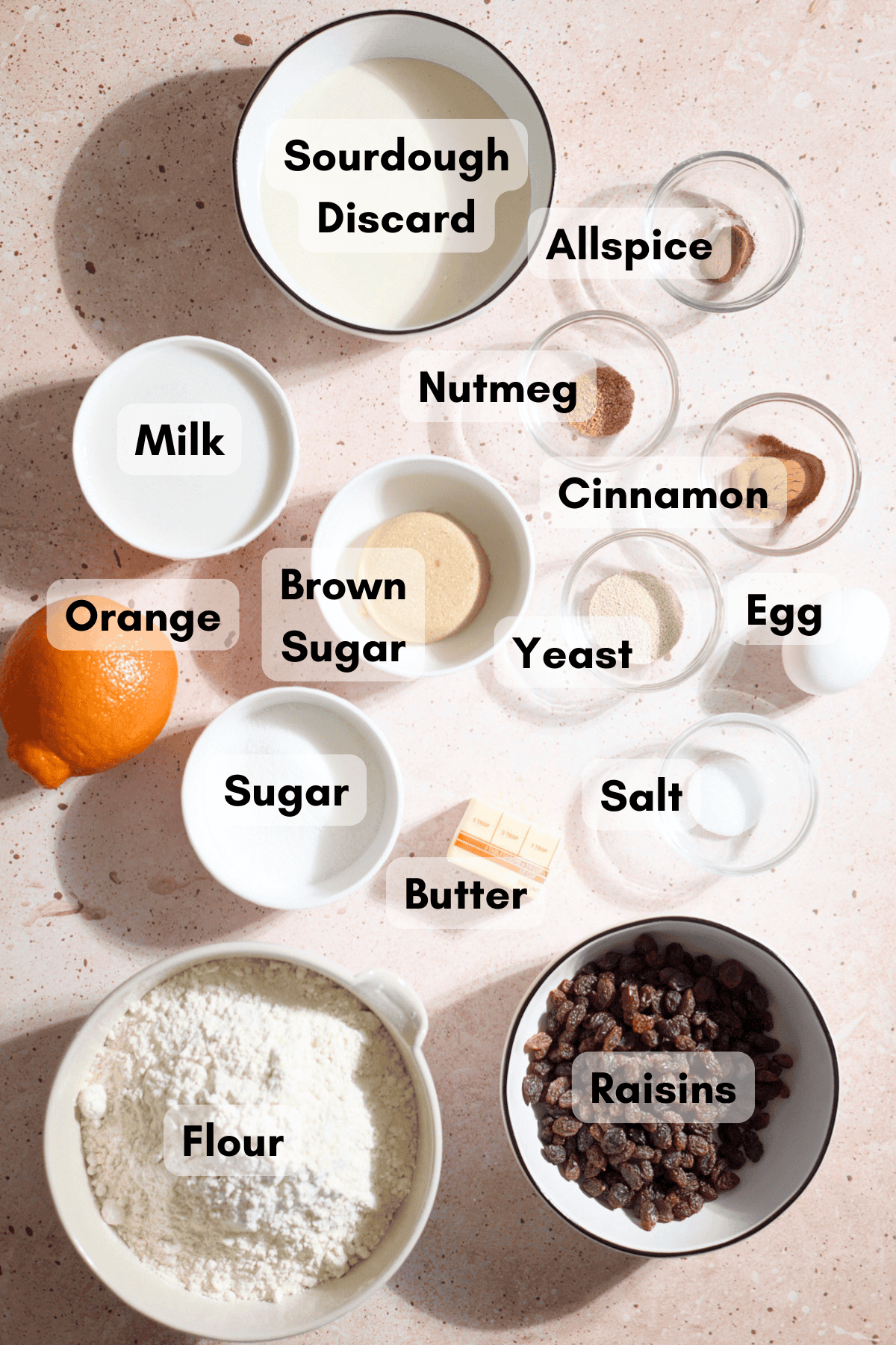 Ingredients for Sourdough Discard Hot Cross Buns in small bowls.