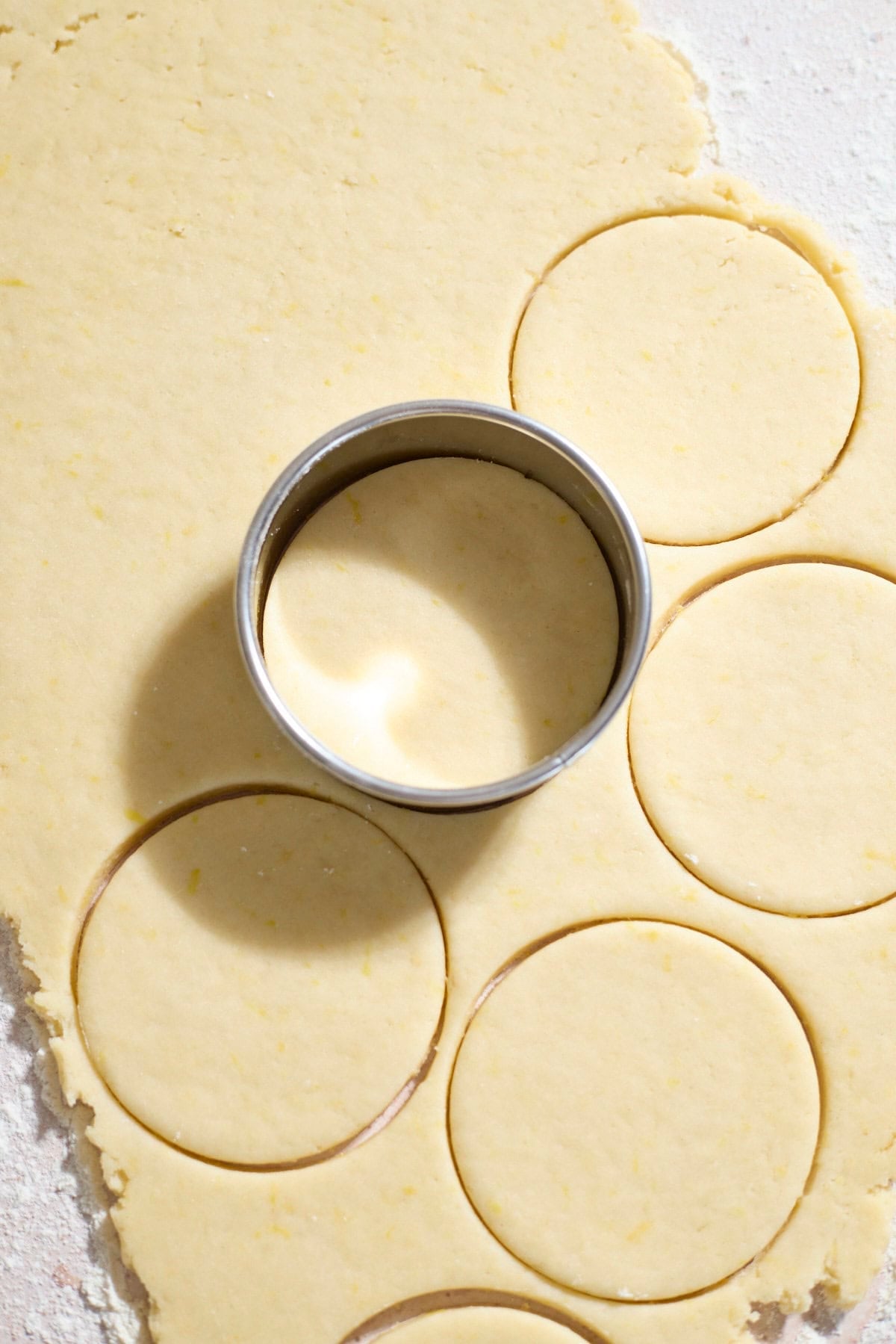 Cookie cutter pressing into the dough.