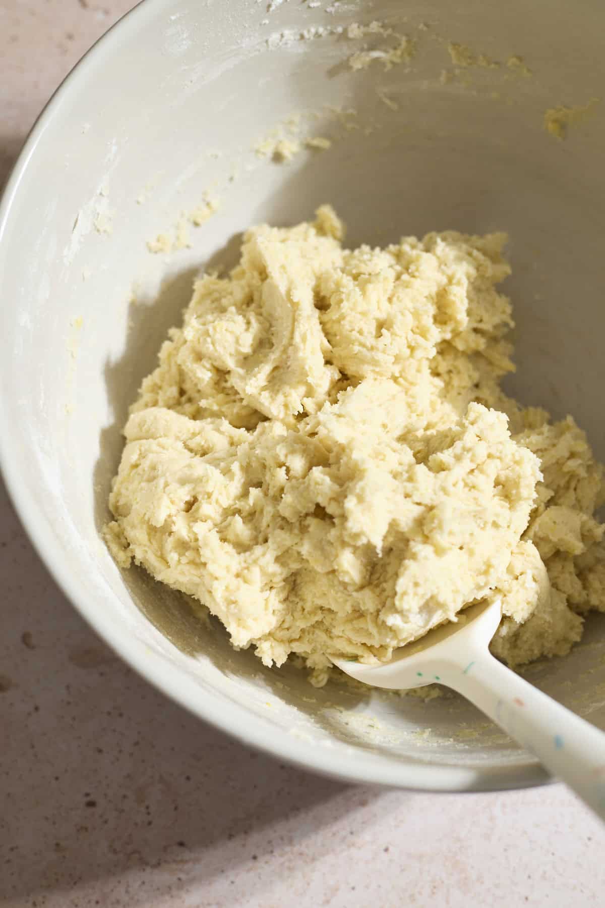 Cookie dough in a large mixing bowl.