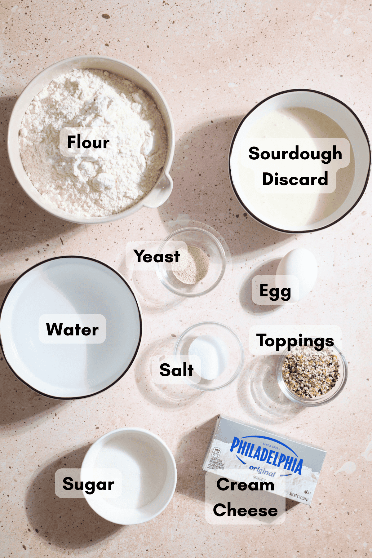 Ingredients for Sourdough Discard Stuffed Bagels in small bowls.