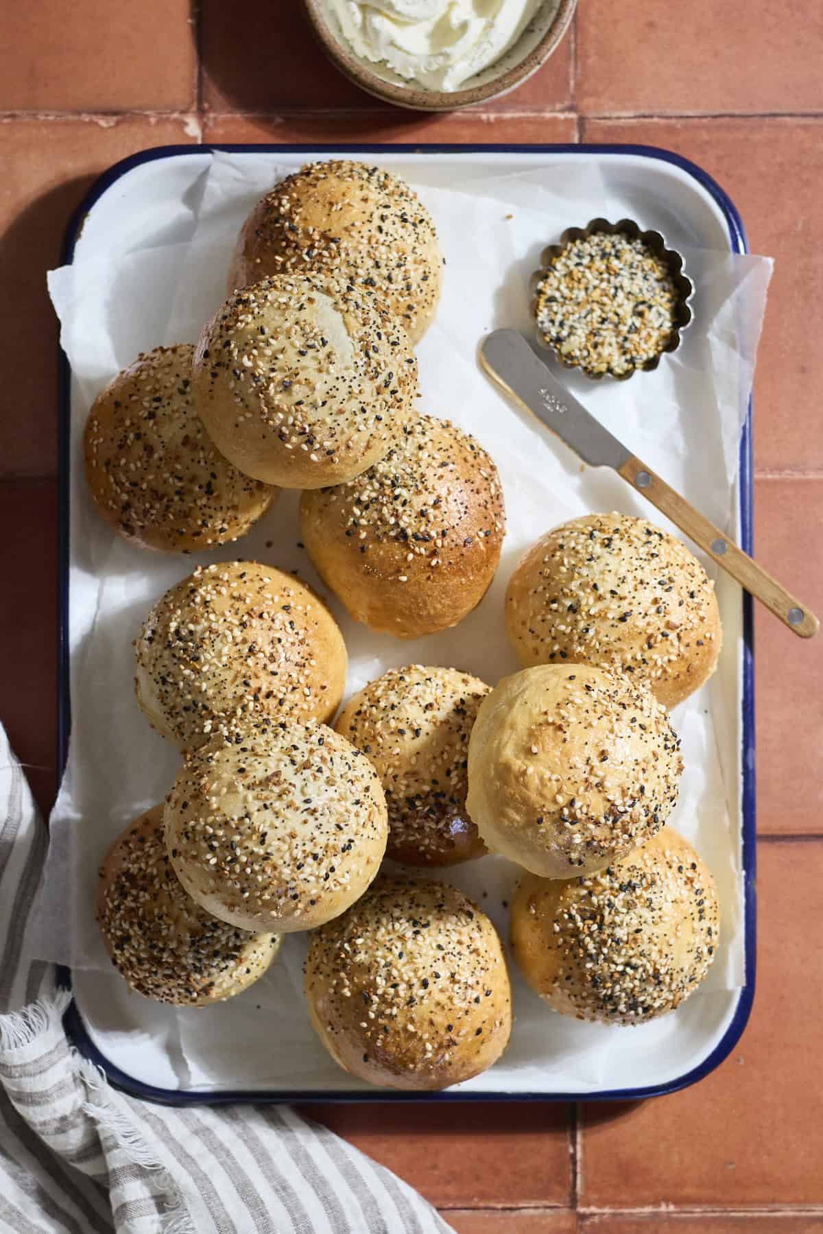 Sourdough Discard Stuffed Bagels on a white tray.