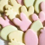 Iced cookies in a variety of colors on a platter.