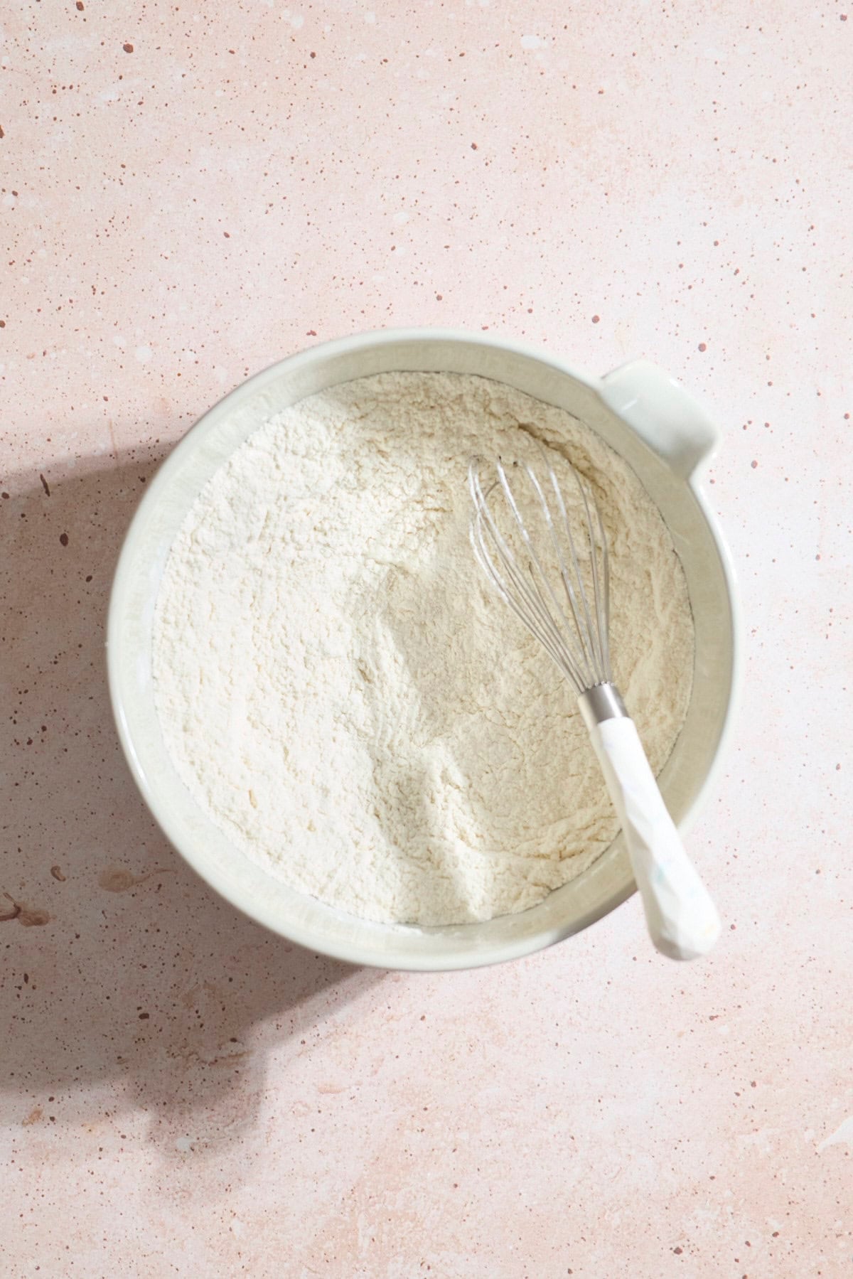 Dry ingredients mixed together in a mixing bowl.