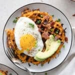 Savory Sweet Potato Waffles topped with egg and avocado.
