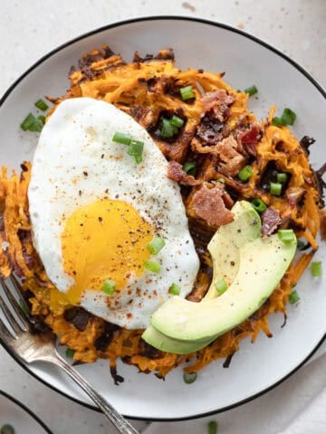 Savory Sweet Potato Waffles topped with egg and avocado.