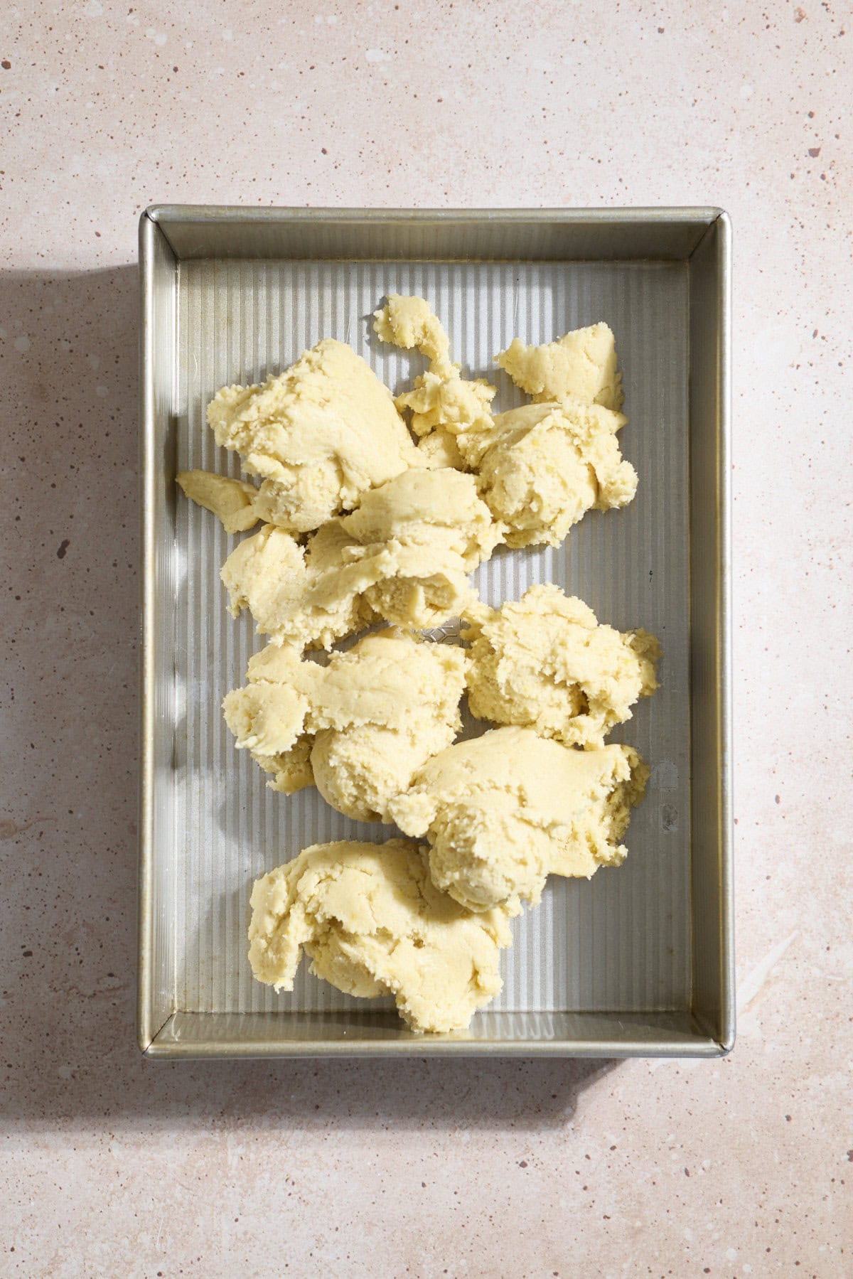 Dough spread in the baking pan.