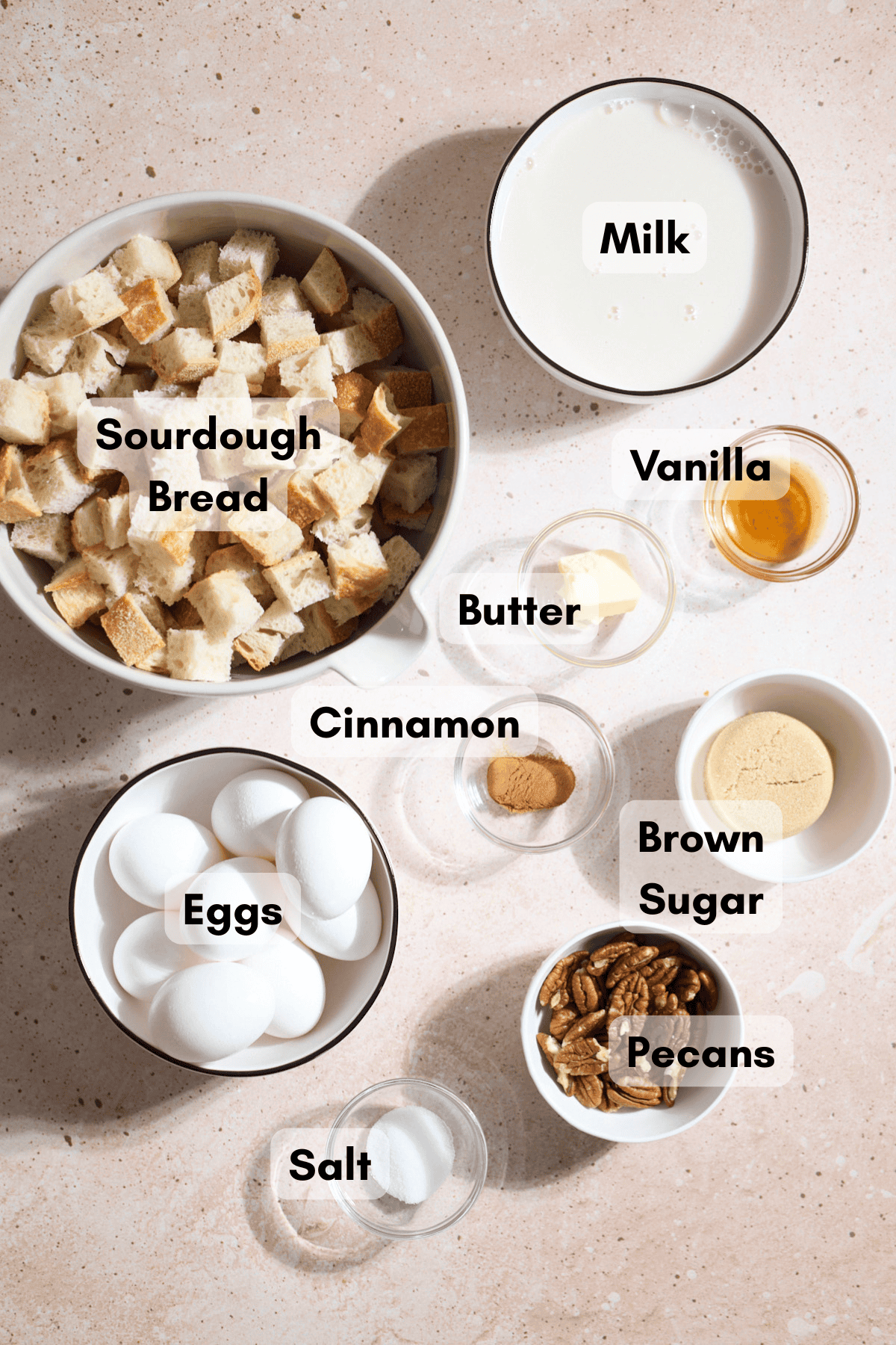 Ingredients for Sourdough French Toast Casserole in small bowls.