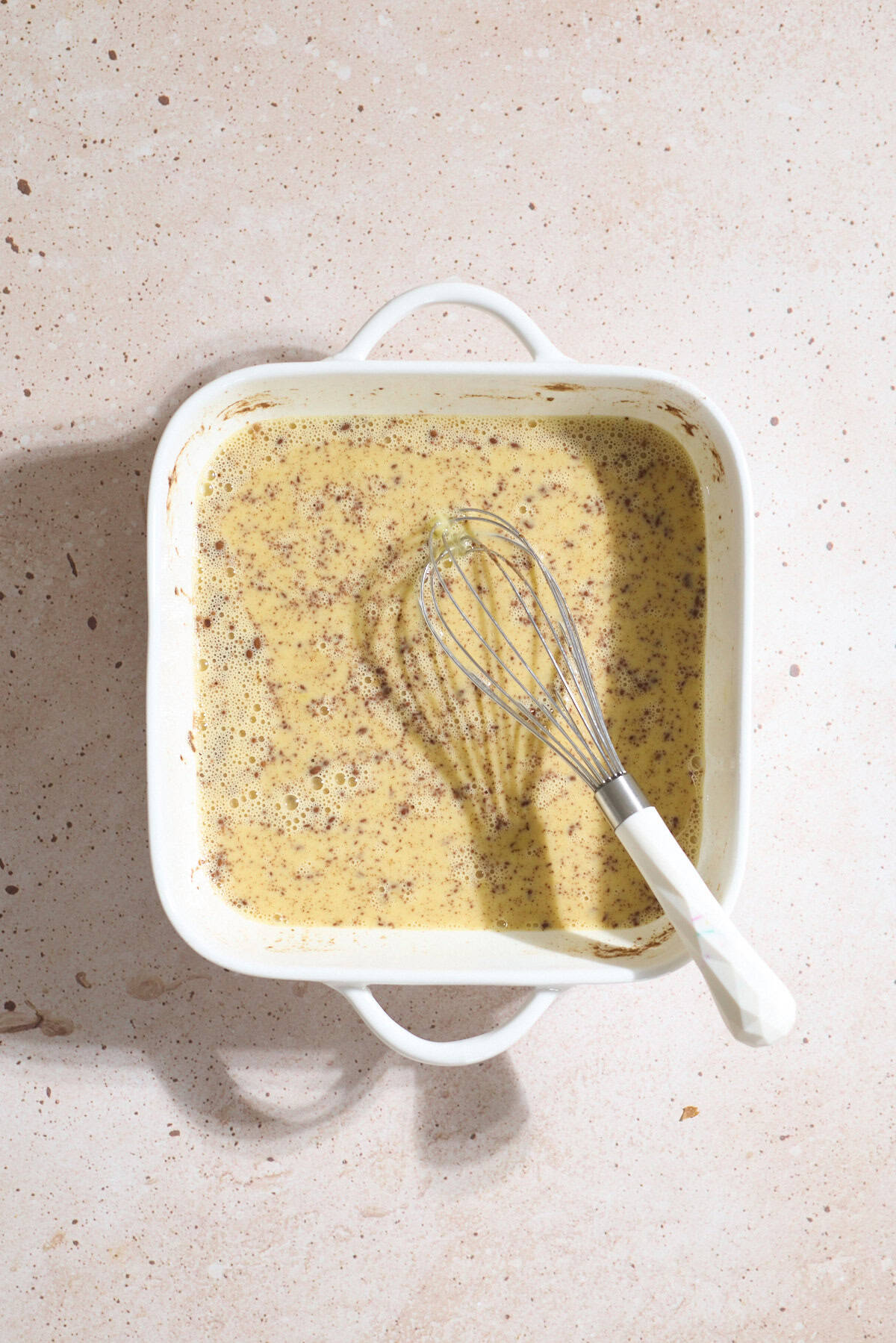 Egg mixture in a small casserole dish.