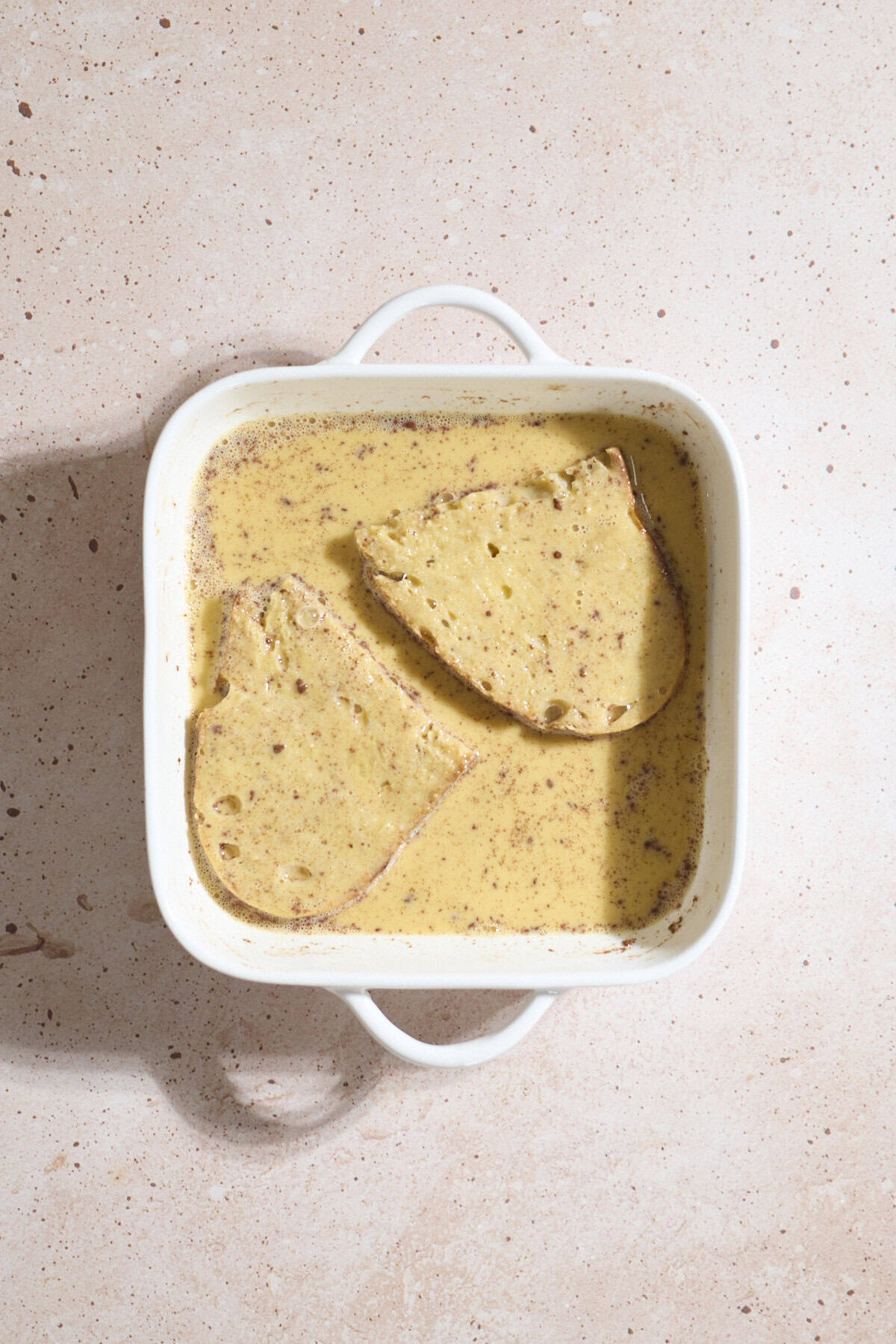 Toast soaking in the egg mixture.
