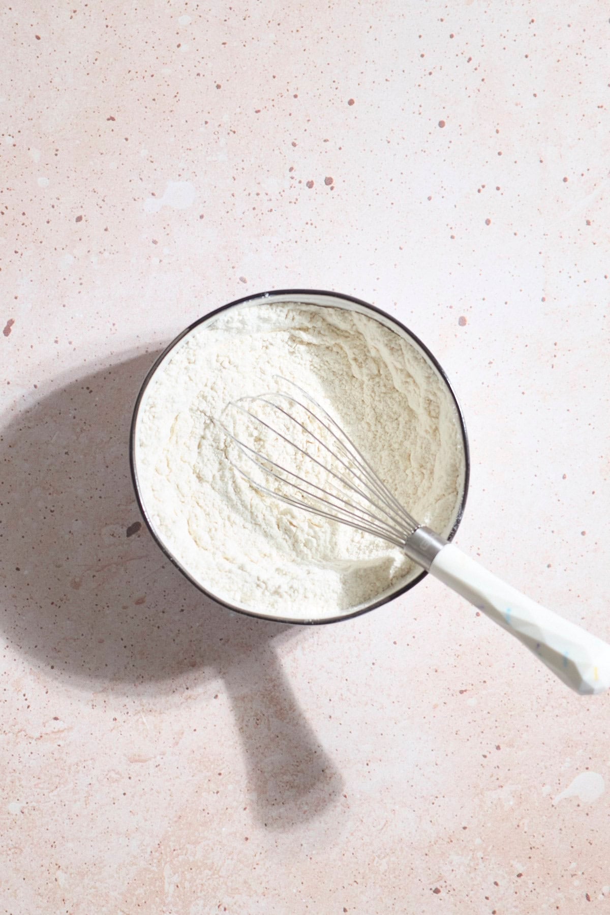Dry ingredients mixed together in a mixing bowl.