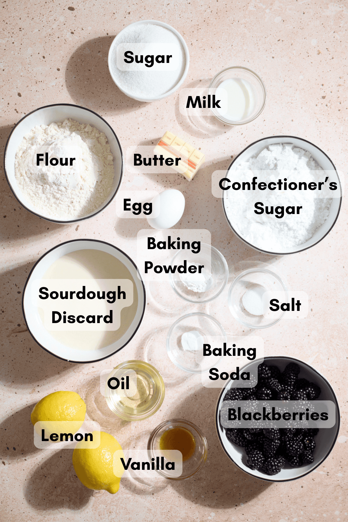 Ingredients for Sourdough Lemon Blackberry Cake in small bowls.