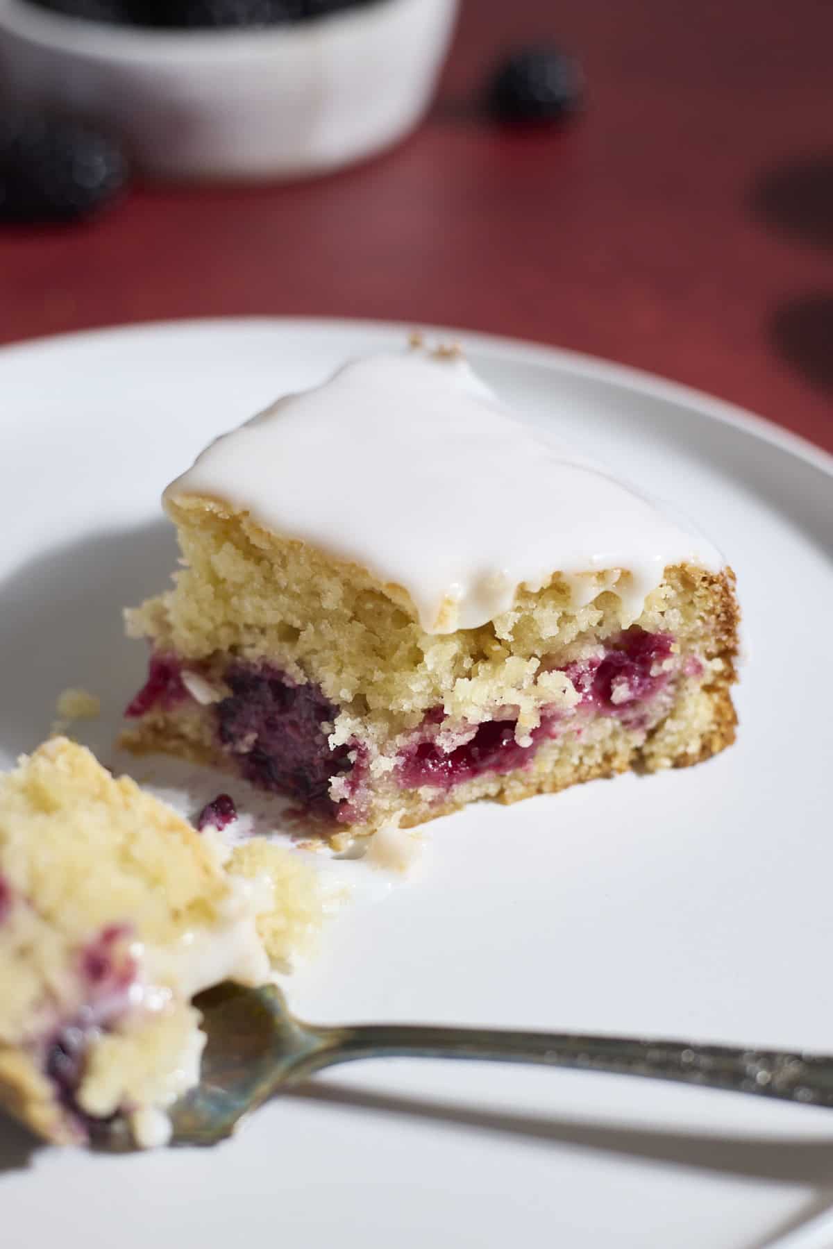 Berries in a slice of Sourdough Lemon Blackberry Cake.