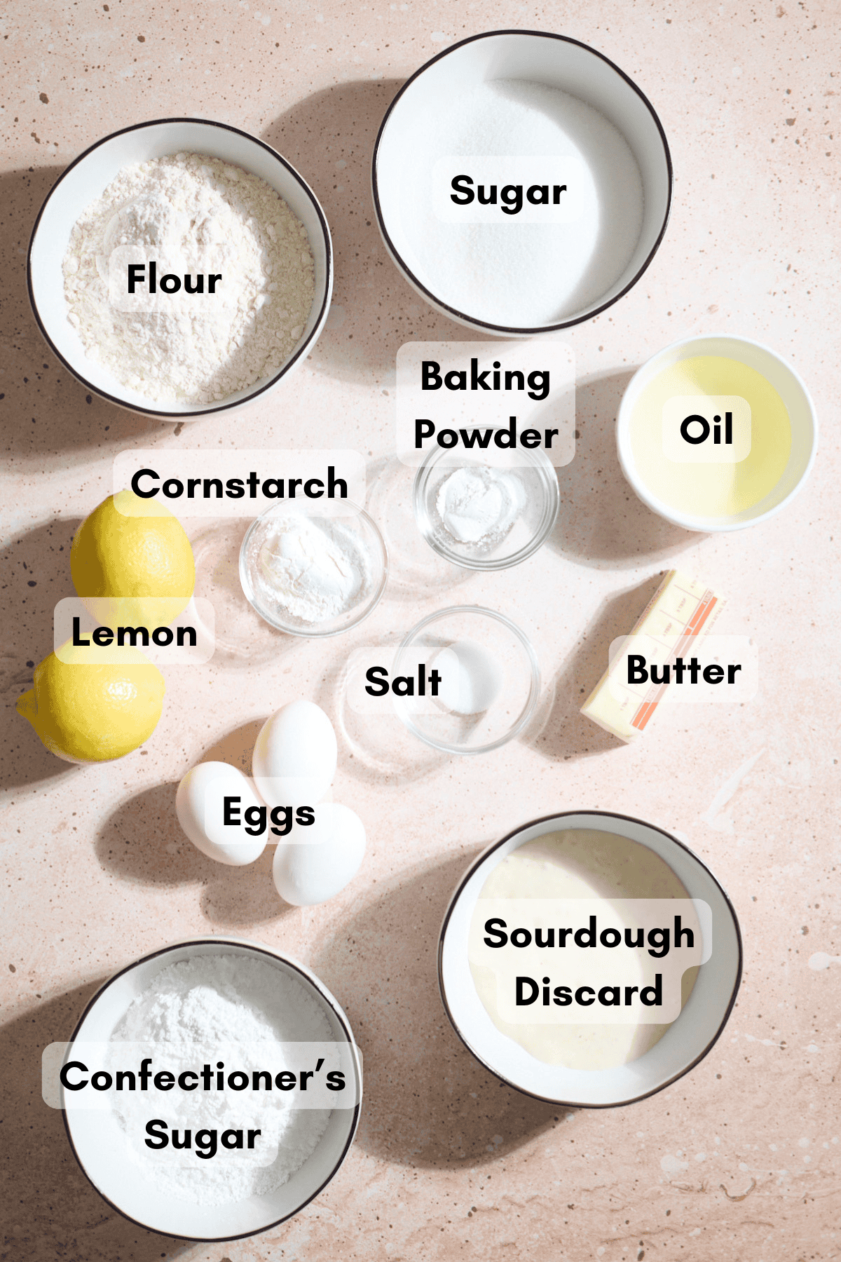 Ingredients for Sourdough Lemon Loaf Cake in small bowls.