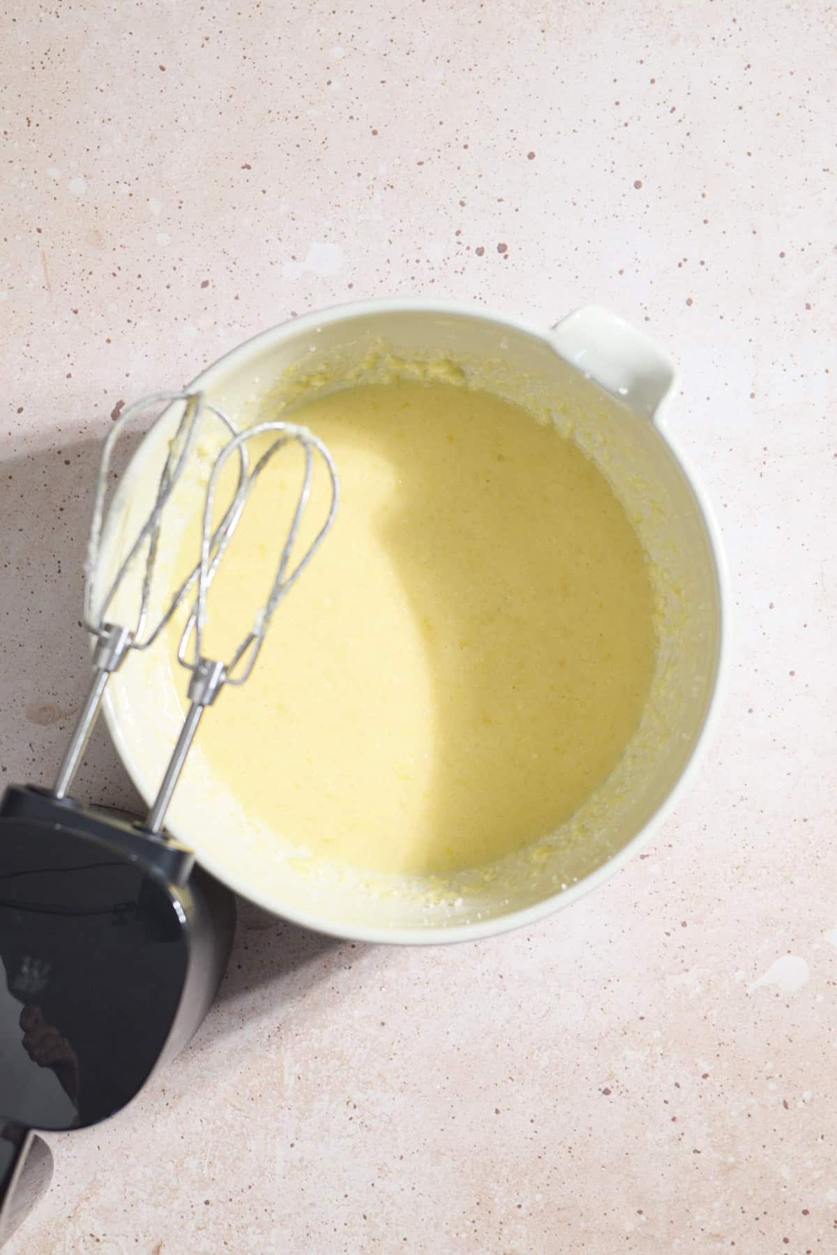 Wet ingredients mixed together in a large mixing bowl.