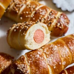 Sourdough Discard Pretzel-Wrapped Hot Dogs in a pile.