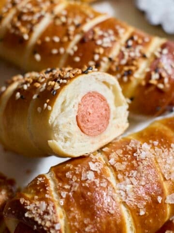 Sourdough Discard Pretzel-Wrapped Hot Dogs in a pile.