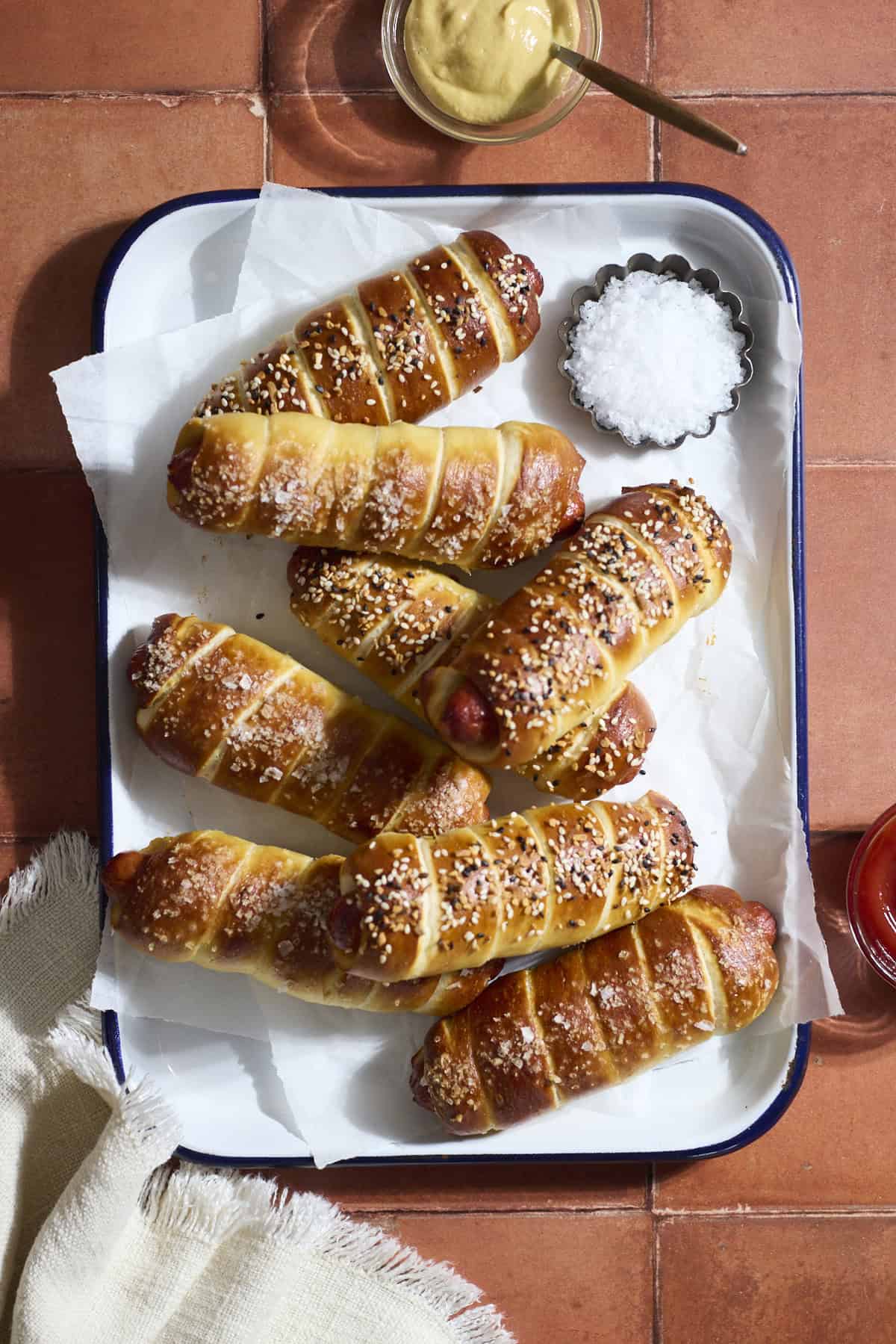 Sourdough Discard Pretzel-Wrapped Hot Dogs on a white tray.