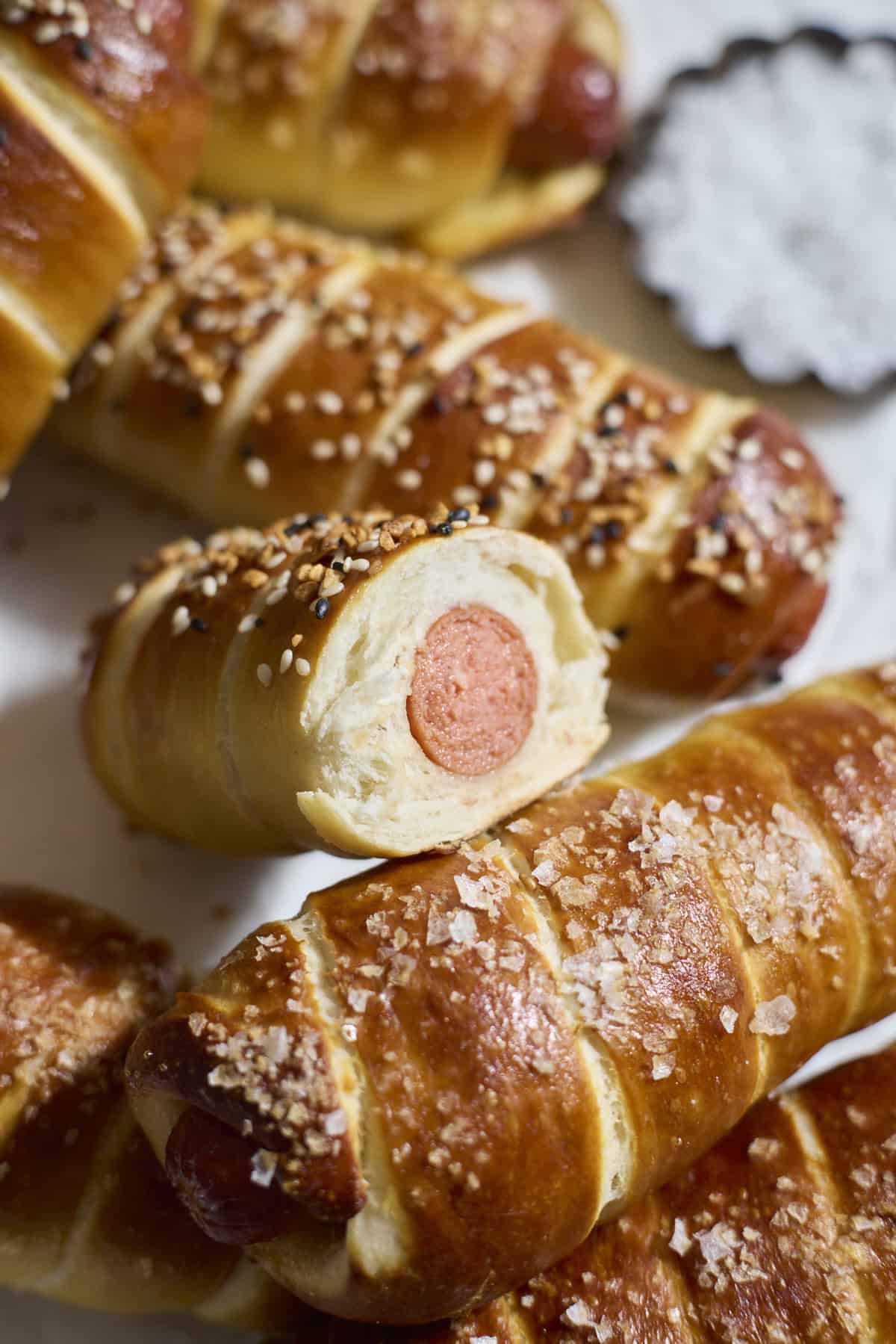 Sourdough Discard Pretzel-Wrapped Hot Dogs in a pile.