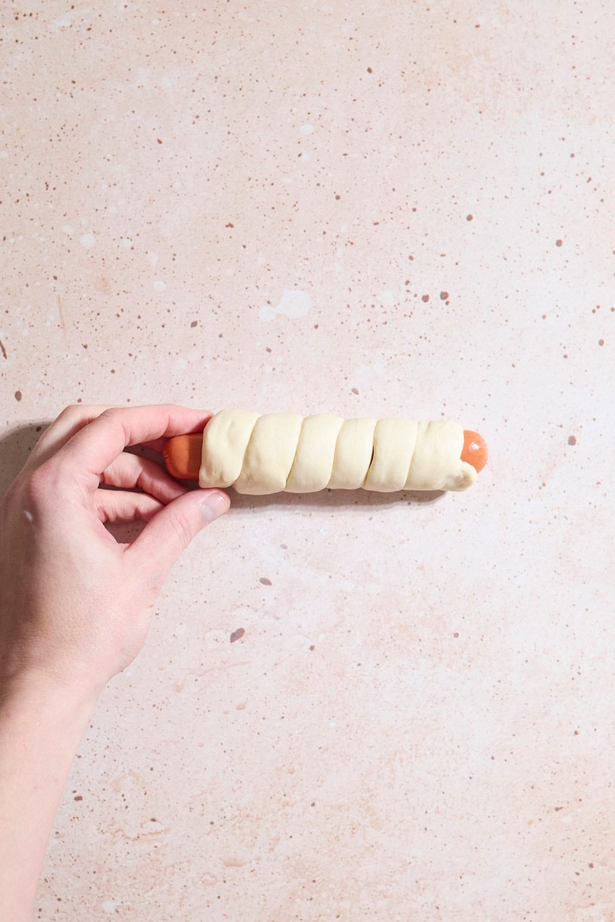 Dough wrapped around the hot dog.