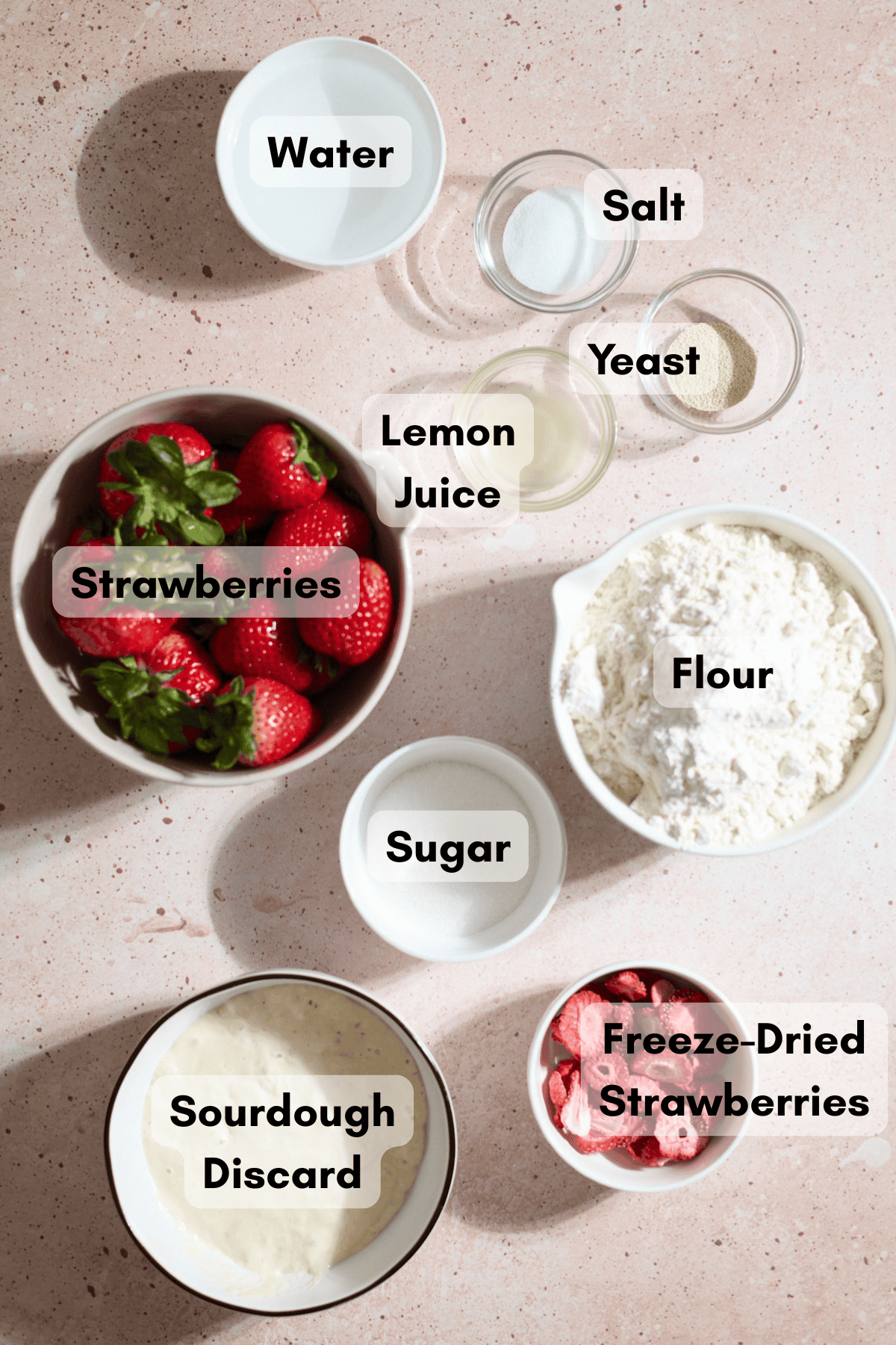 Ingredients for Sourdough Discard Strawberry Bagels in small bowls.