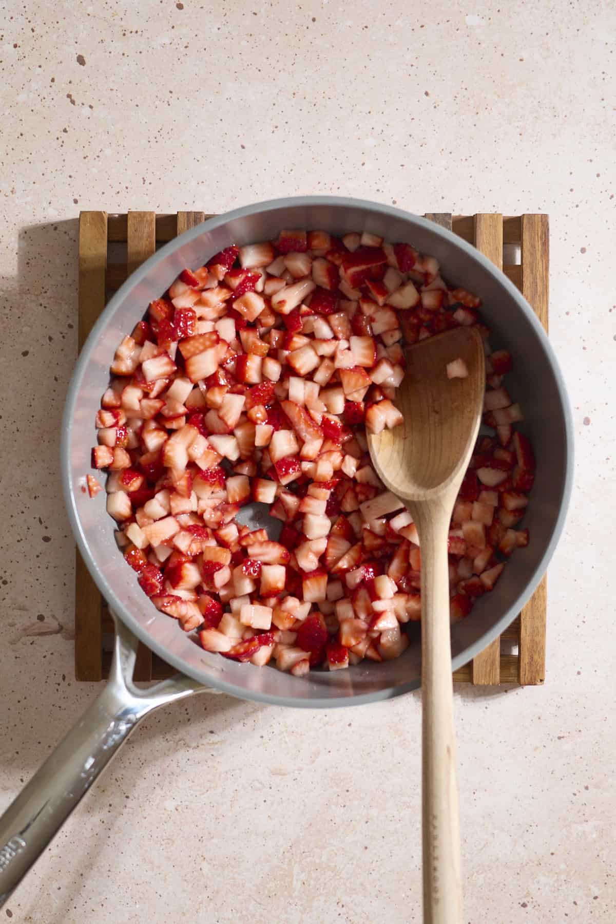 Diced berries in a large skillet.