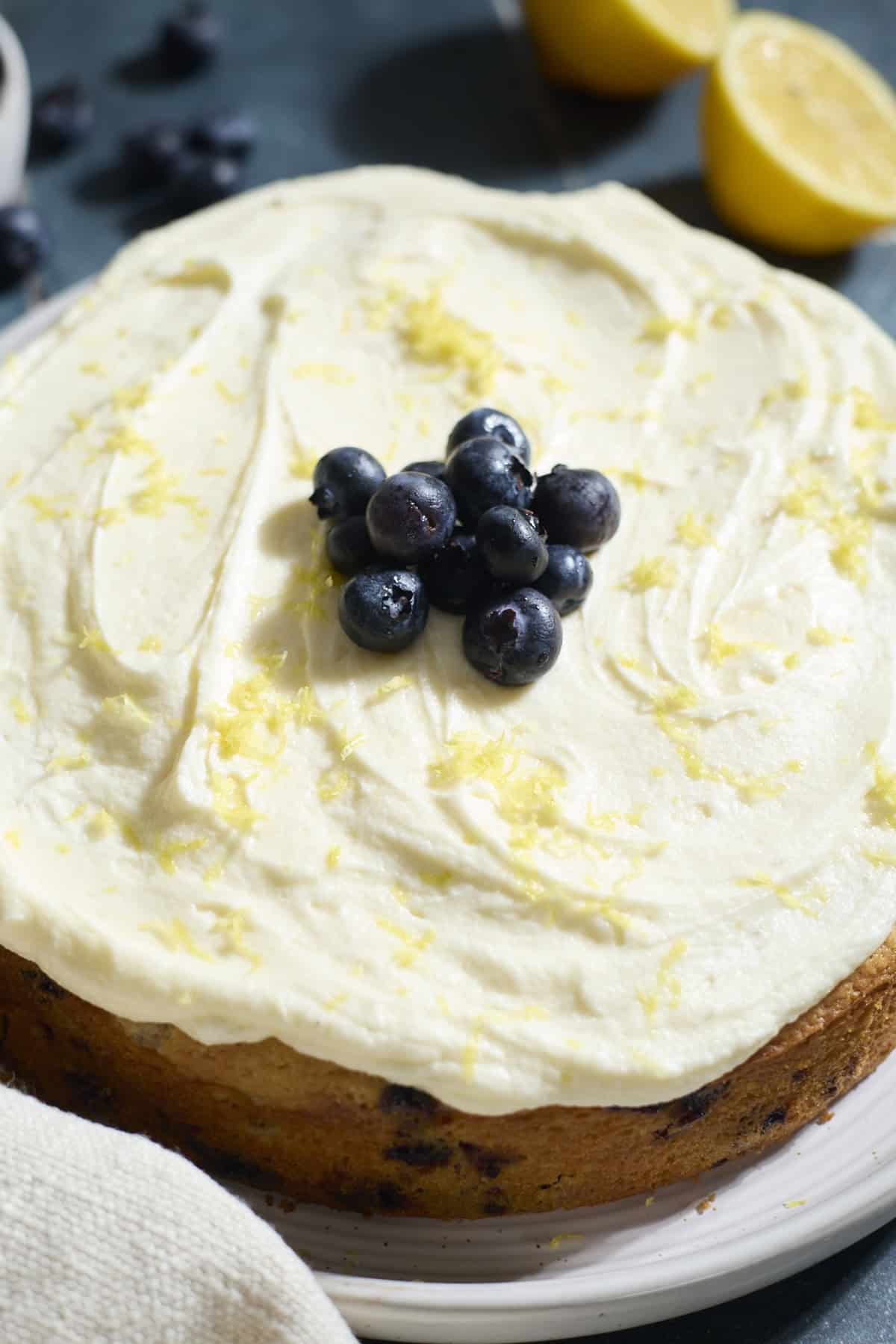 Blueberries on top of the frosting.