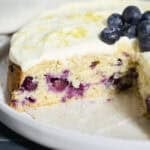 Blueberries in a slice of Sourdough Lemon Blueberry Cake.