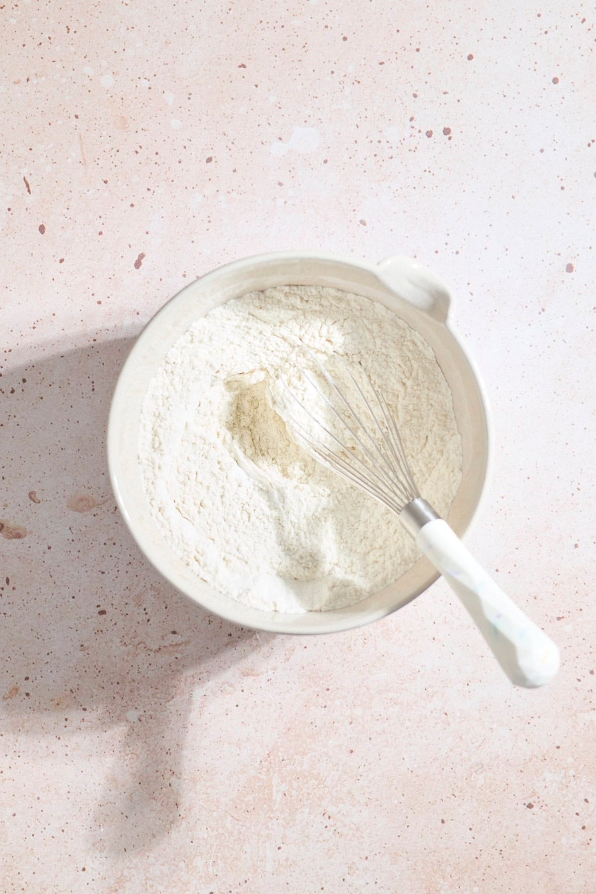 Dry ingredients mixed in a mixing bowl.