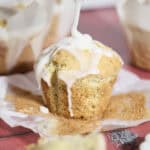 Sourdough Lemon Poppy Seed Muffins drizzled with glaze.