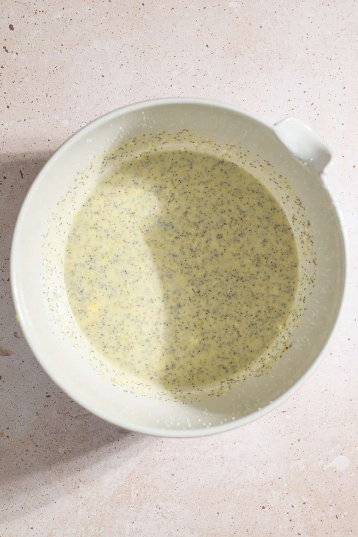 Wet ingredients mixed together in a large mixing bowl.