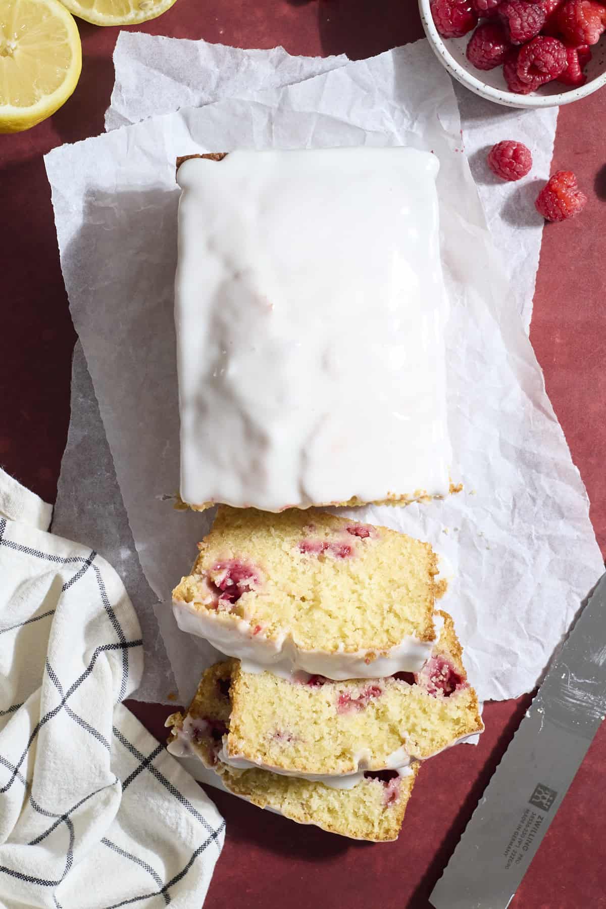 A sliced Sourdough Lemon Raspberry Loaf Cake.