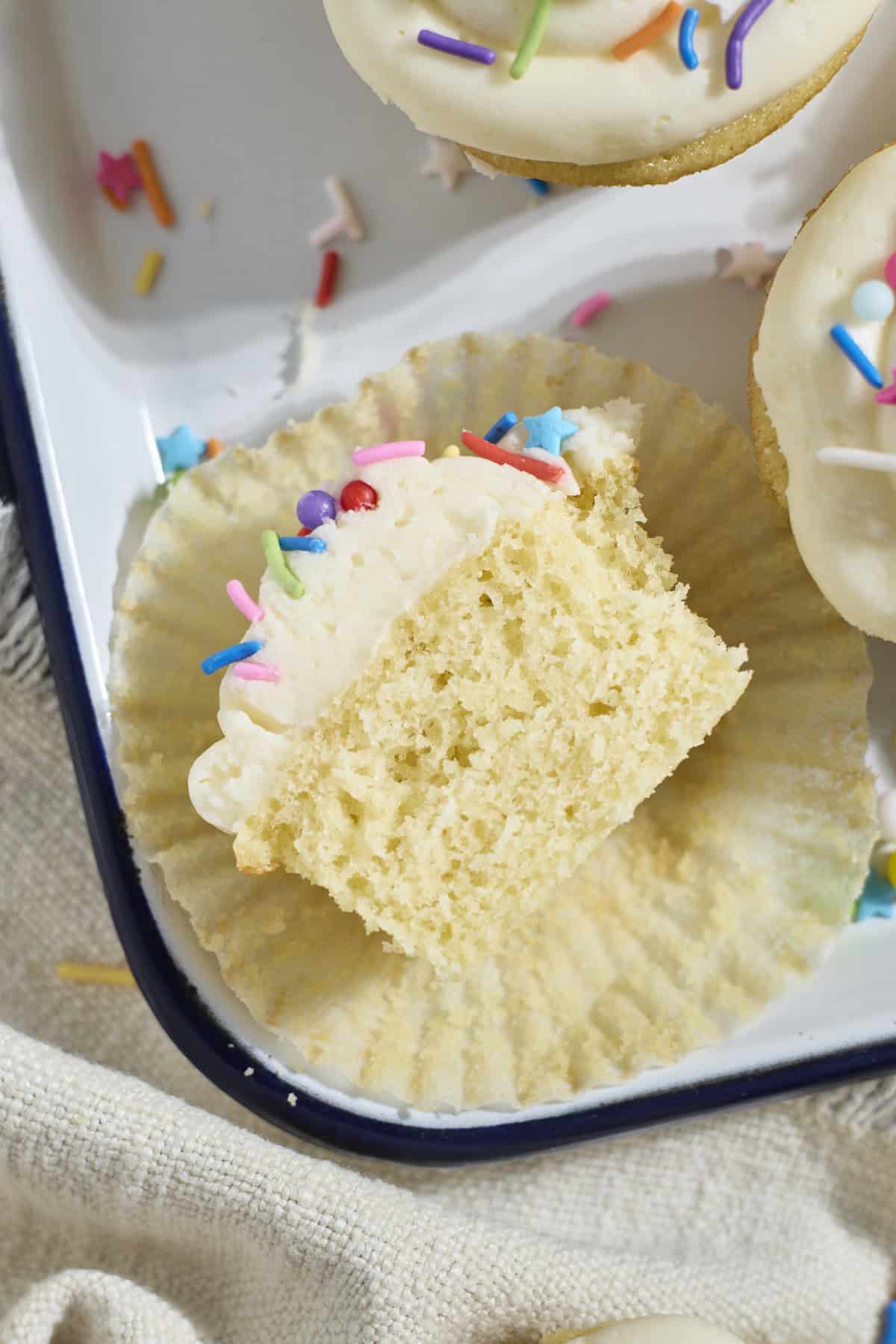 A Sourdough Vanilla Cupcake cut in half.